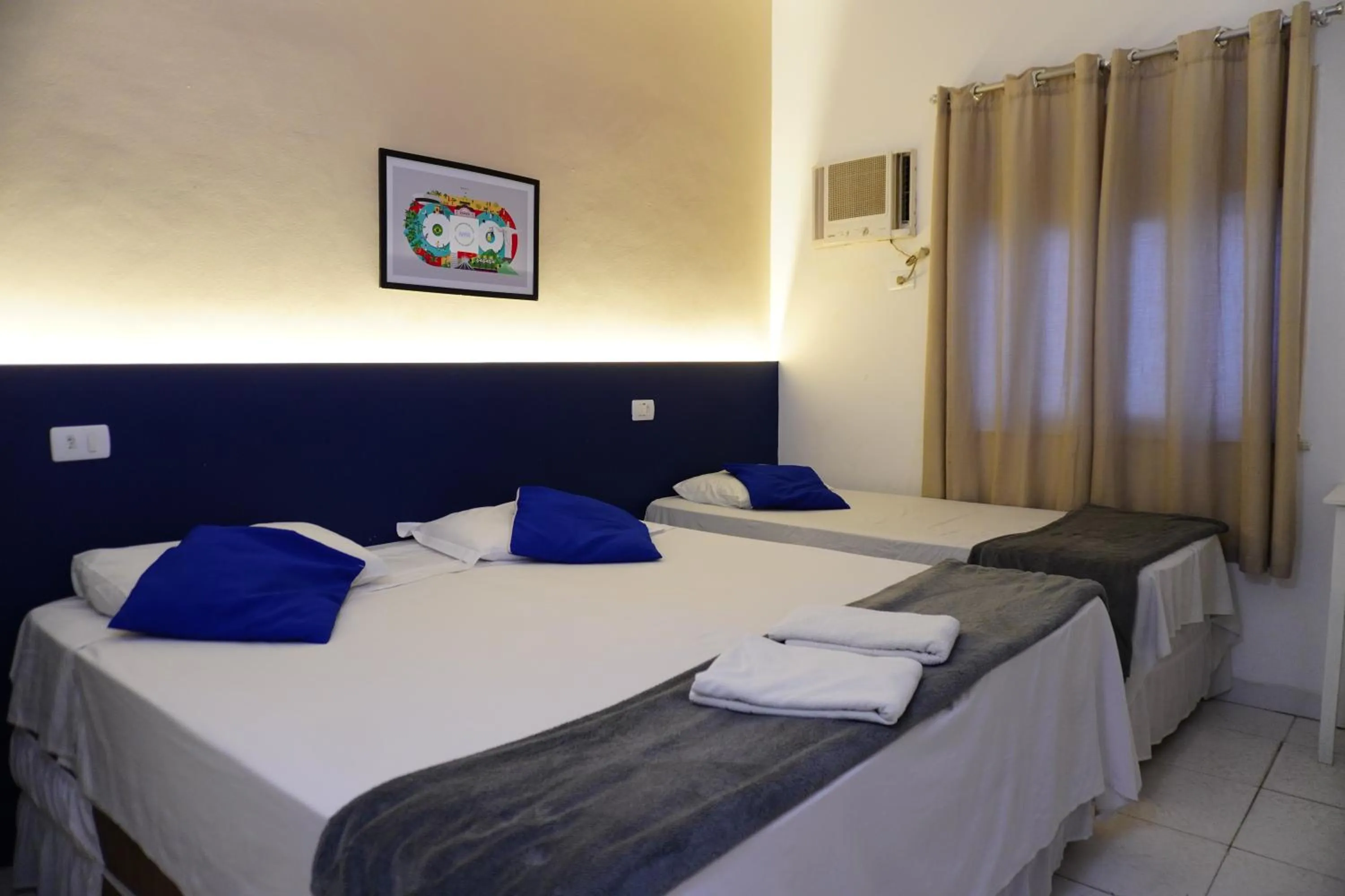 Bed in Copacabana Blue Hotel