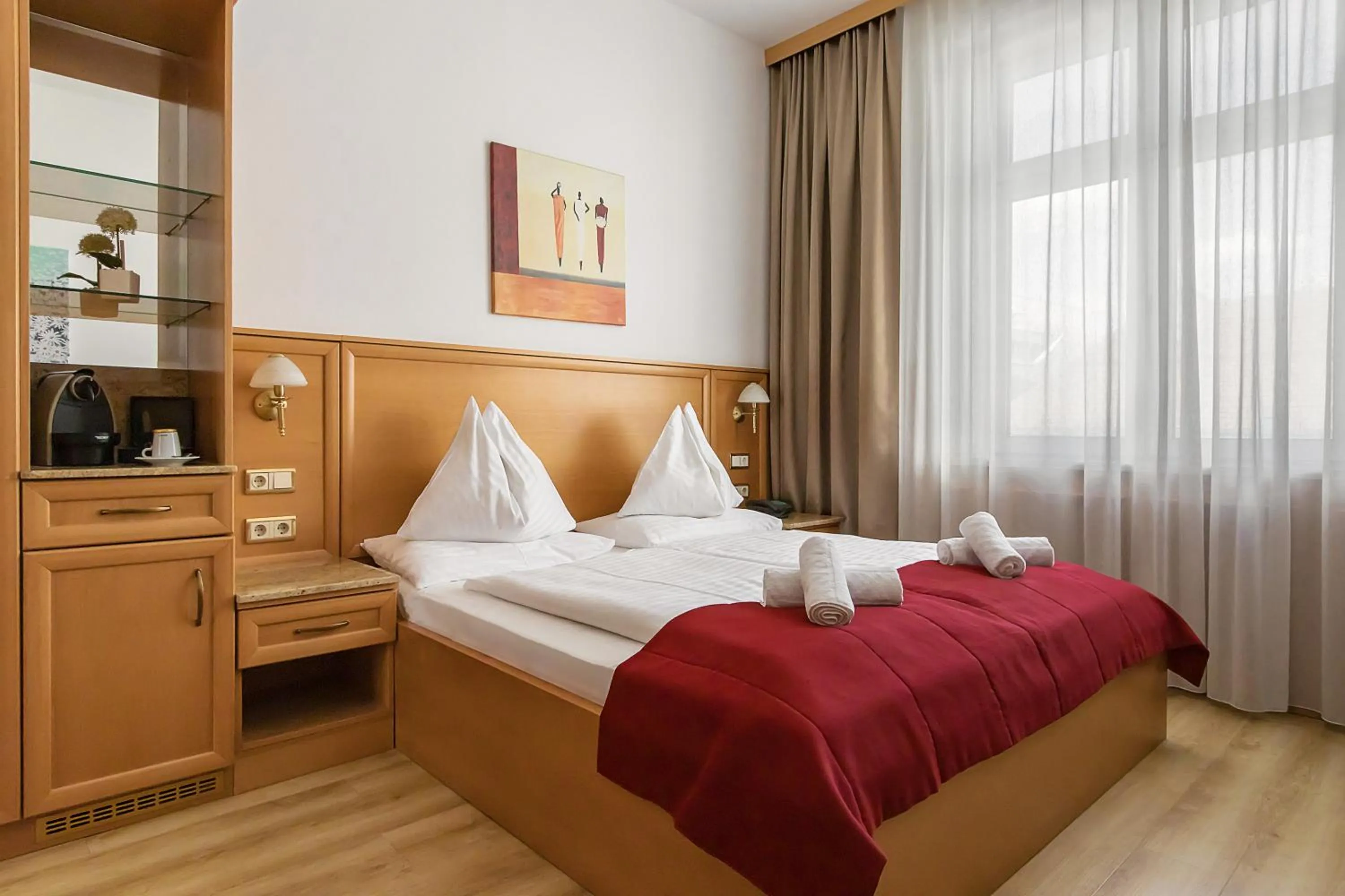 Bed in Hotel Corvinus Vienna