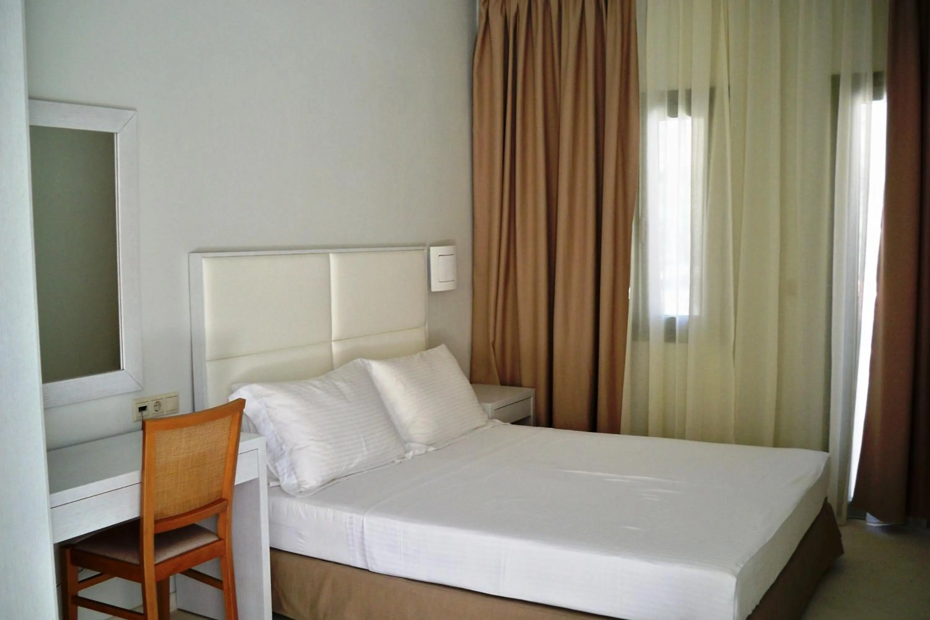 Bed in Aphrodite Samos Suites
