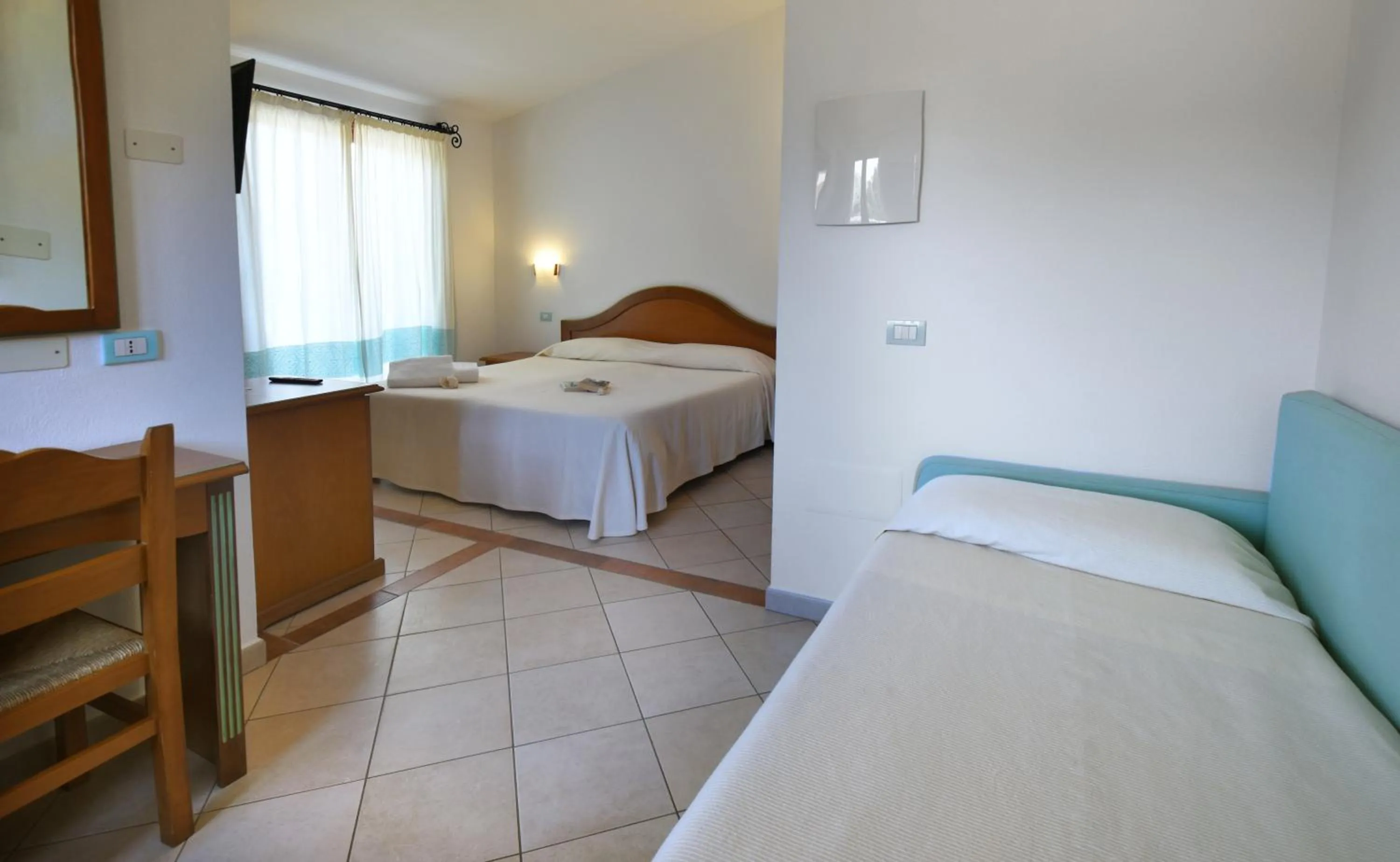 Bed in Le Anfore Hotel