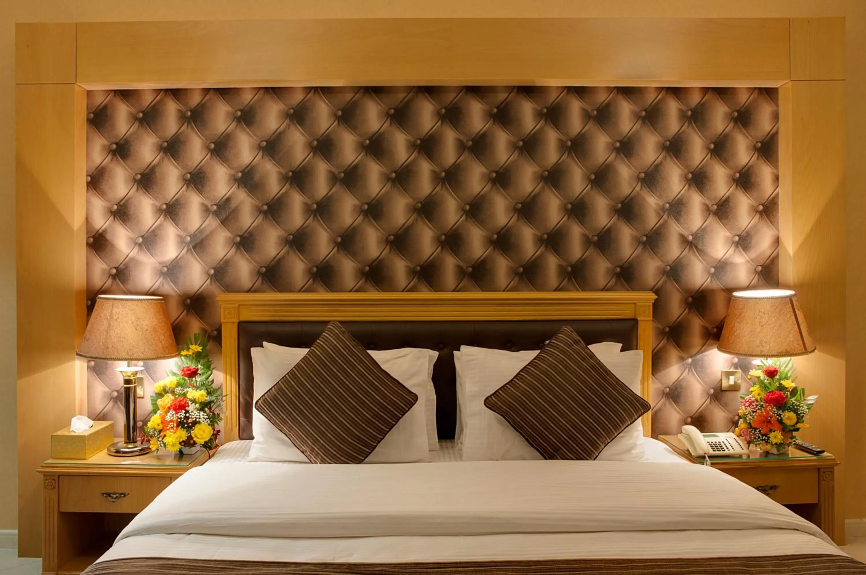 Bed in Deira Suites Deluxe Hotel Suites