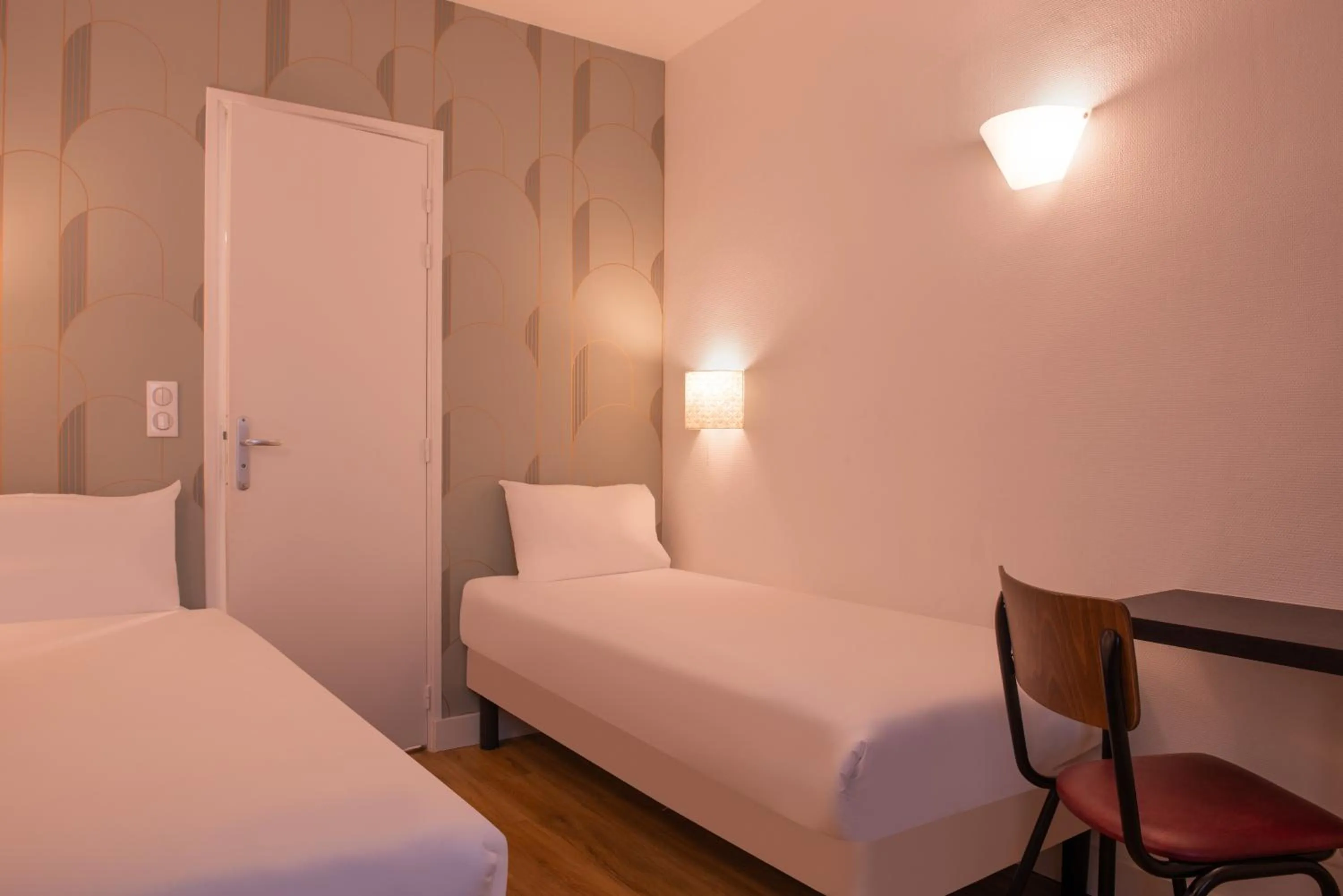 Bed in Au Pacific Hotel