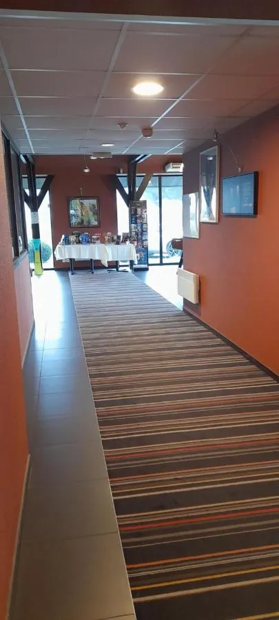 Communal lounge/ TV room in ibis Styles Segre