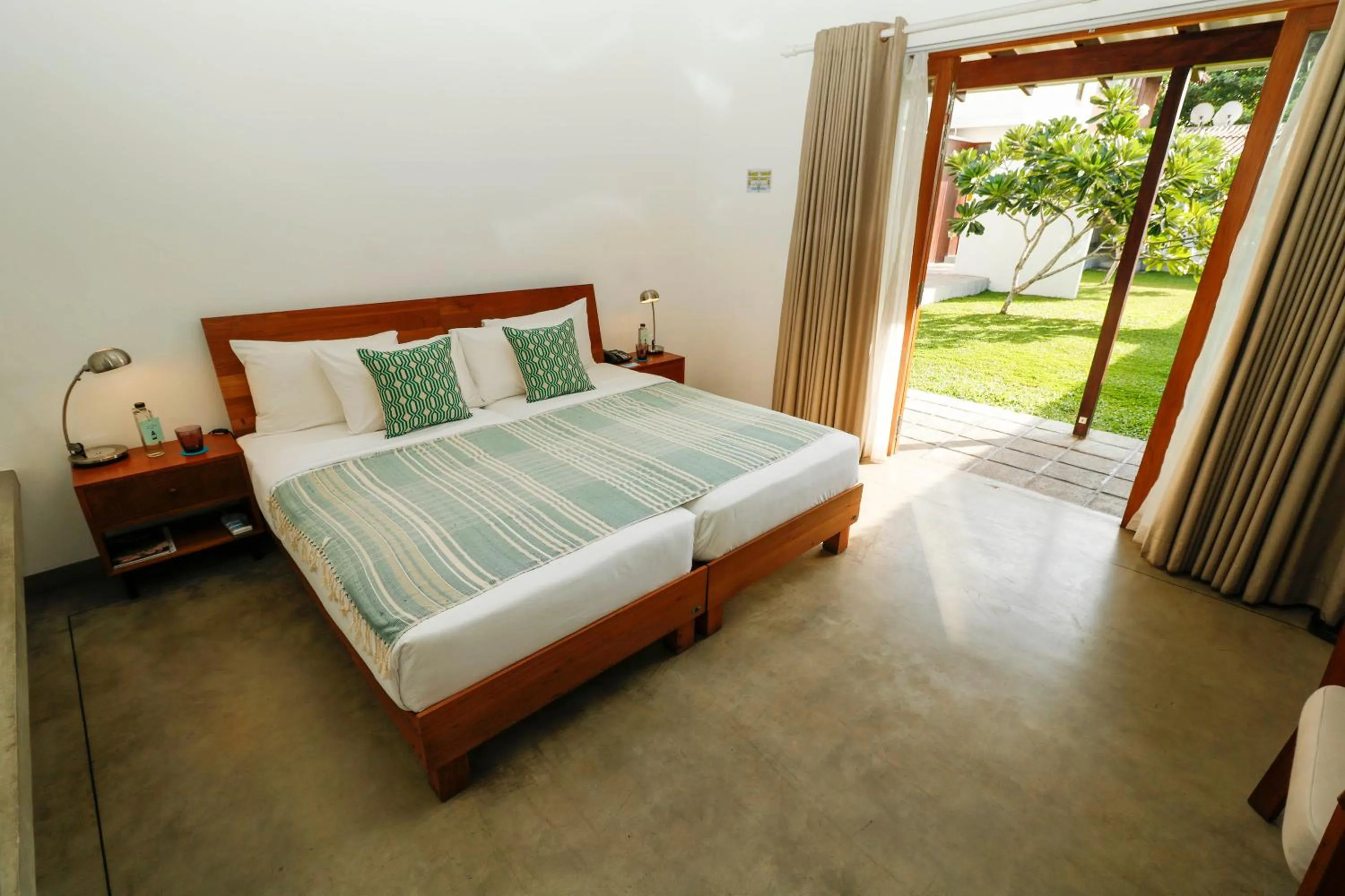 Bed in Ubuntu Beach Villas by Reveal