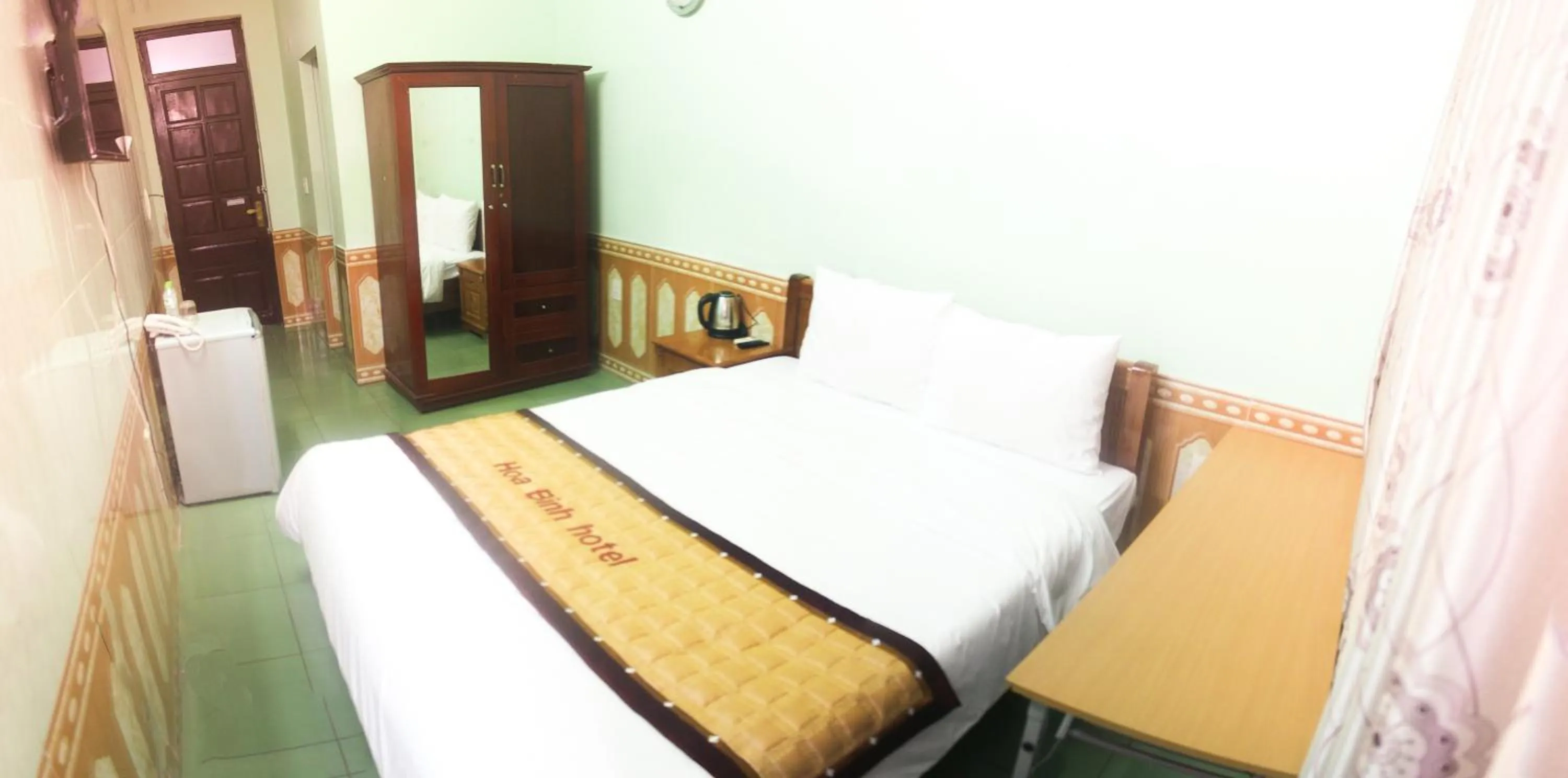 Photo of the whole room, Bed in Hoa Binh Hotel