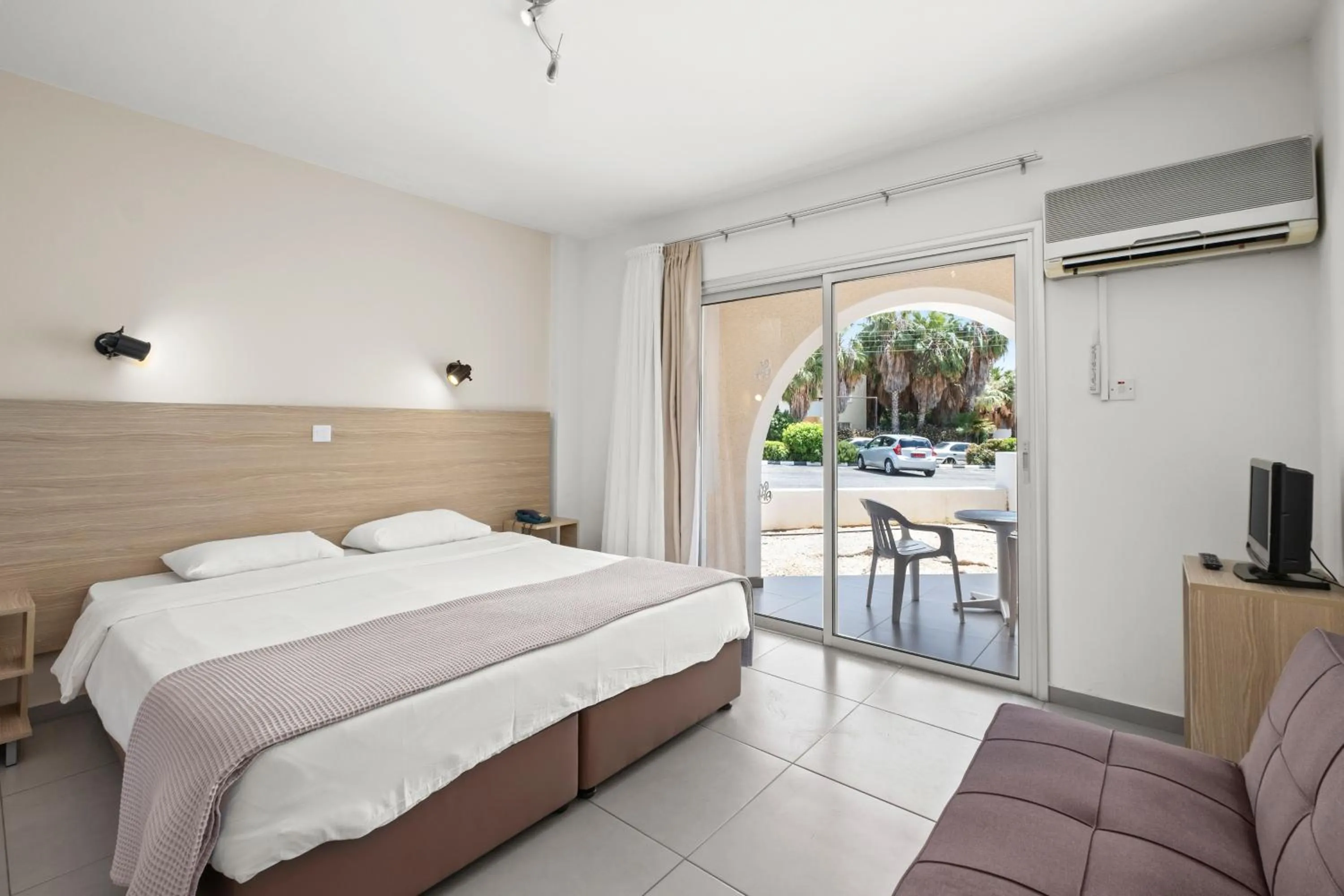 Bed in Pandream Hotel Apartments