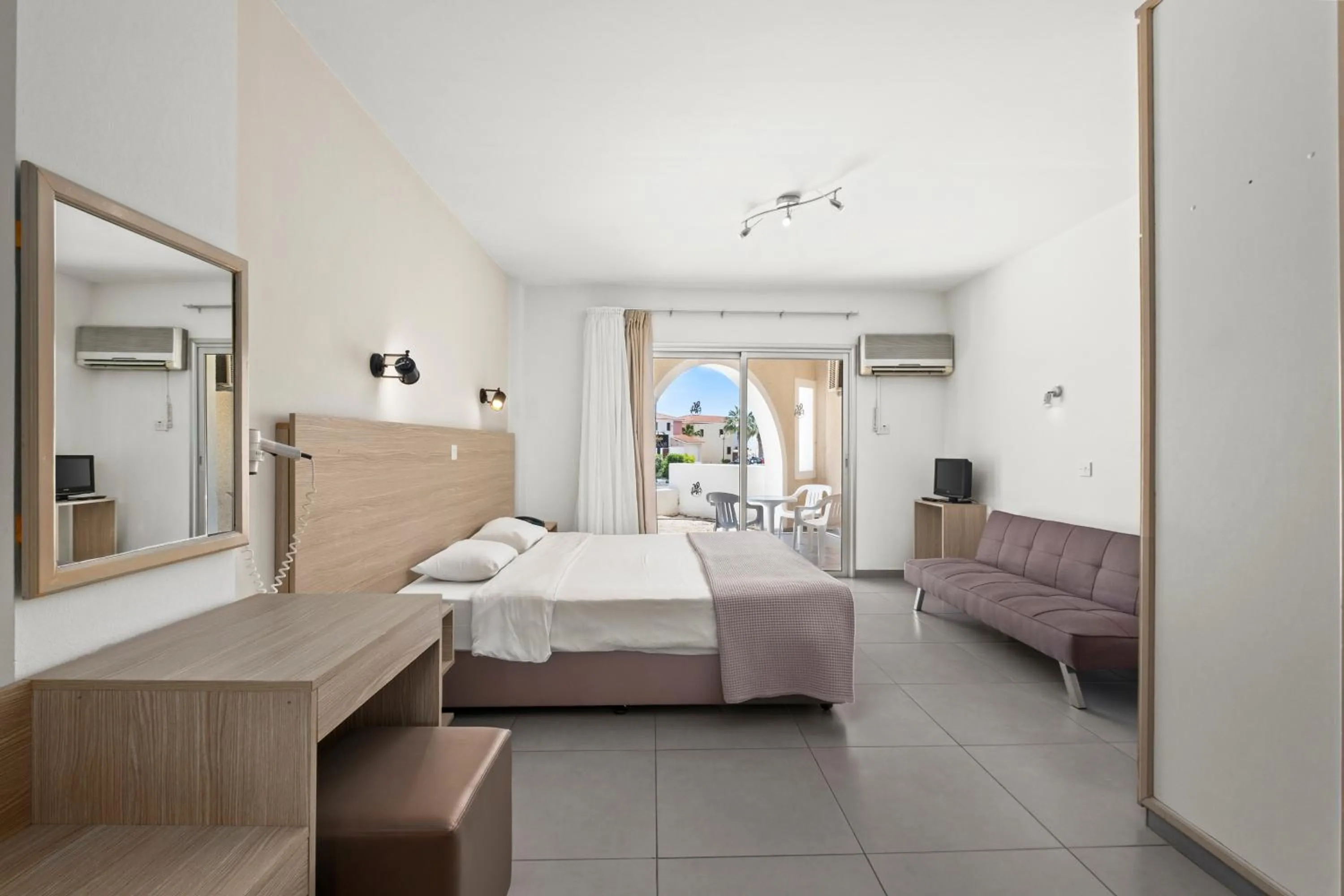 Seating area, Bed in Pandream Hotel Apartments