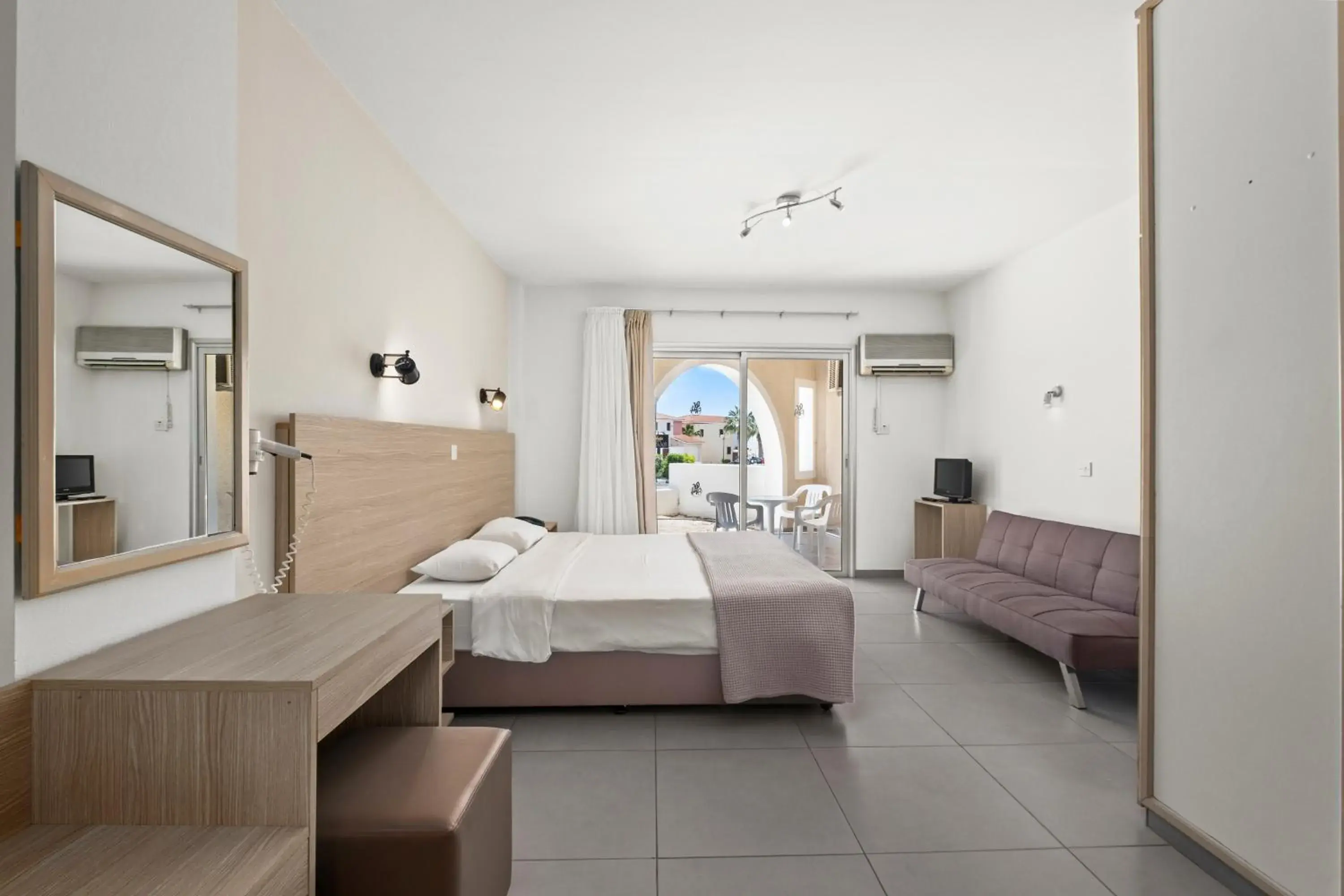 Seating area, Bed in Pandream Hotel Apartments Seating area, Bed in Pandream Hotel Apartments