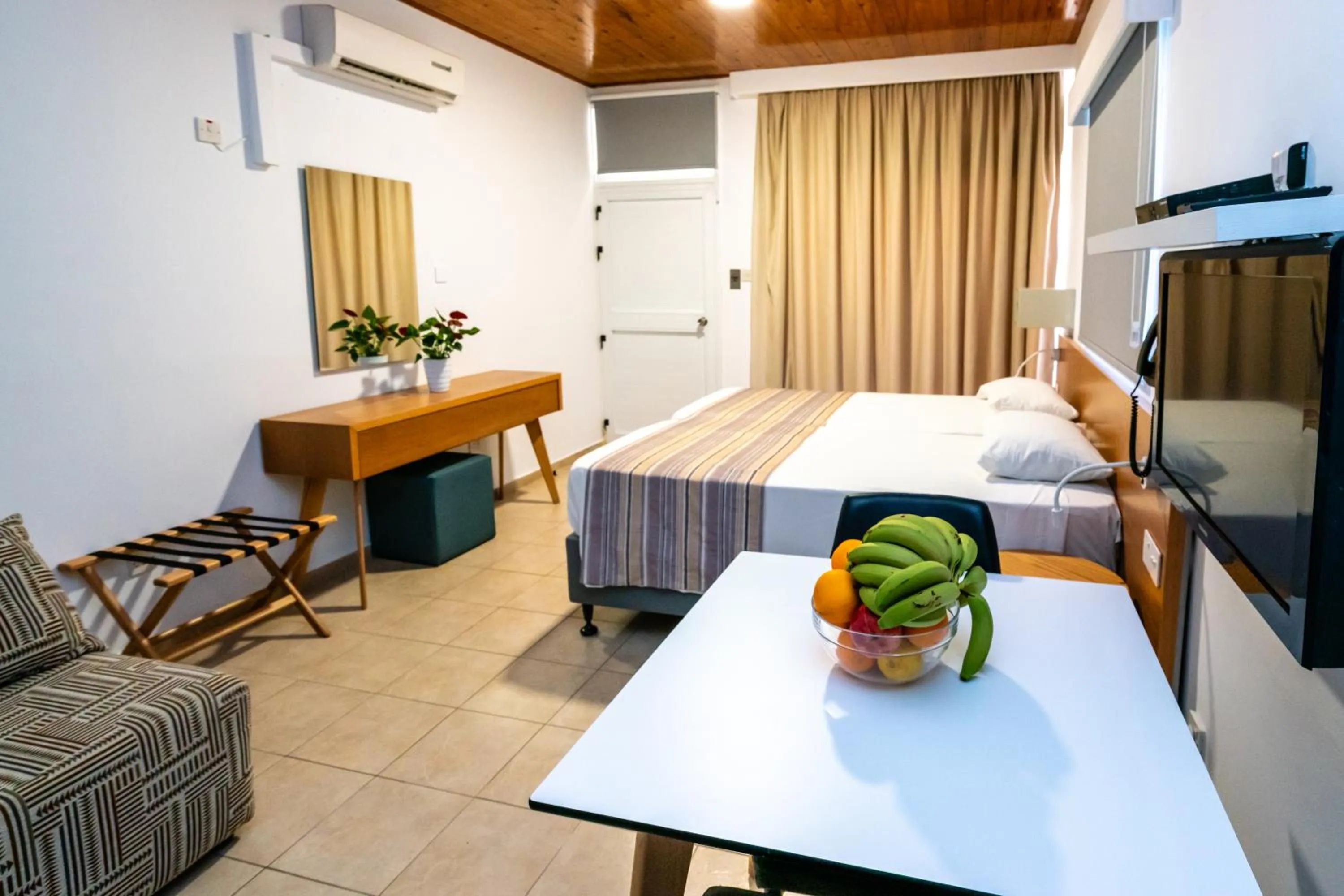 Bed in Helios Bay Hotel and Suites