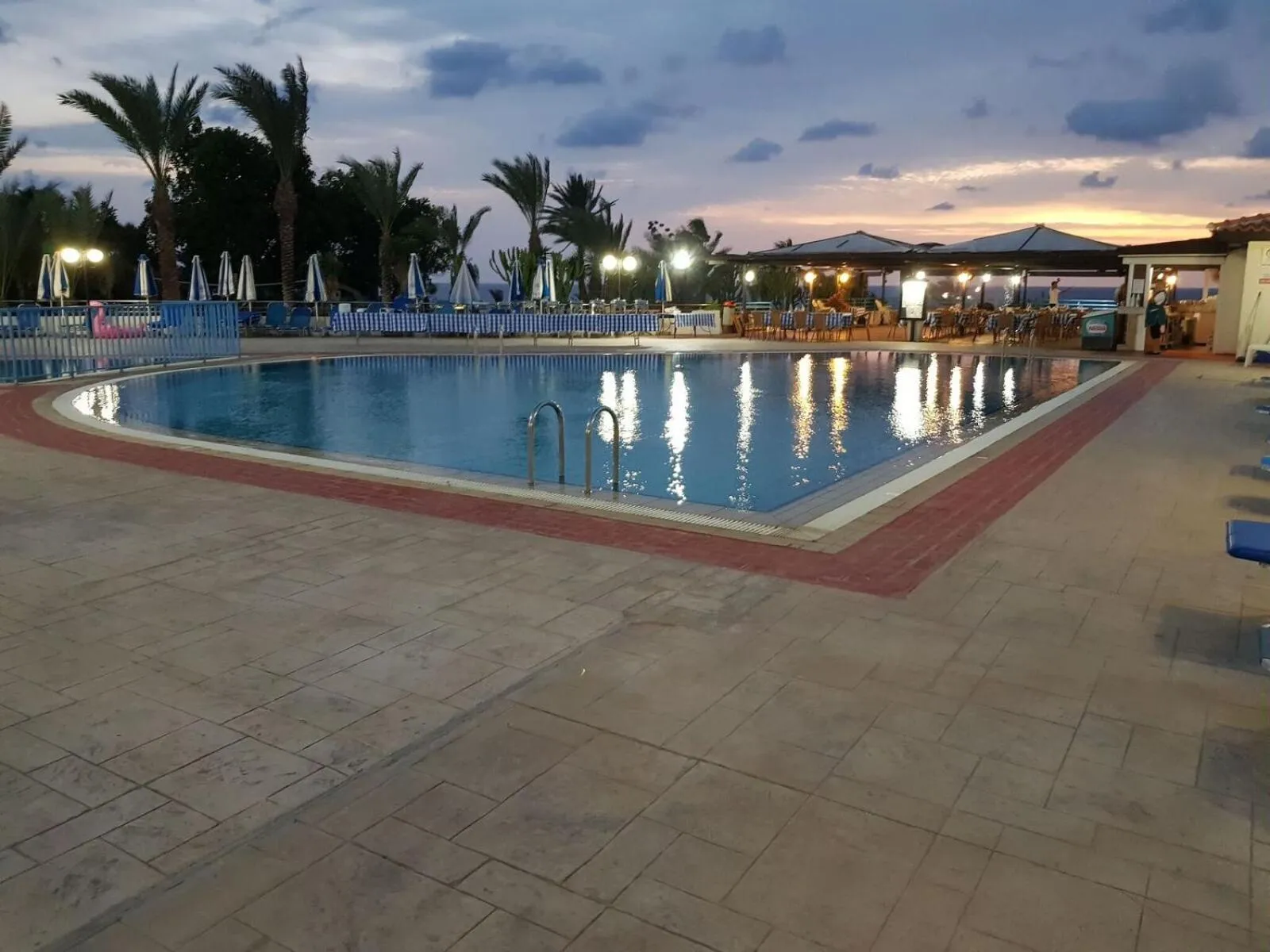 Swimming pool in Helios Bay Hotel and Suites