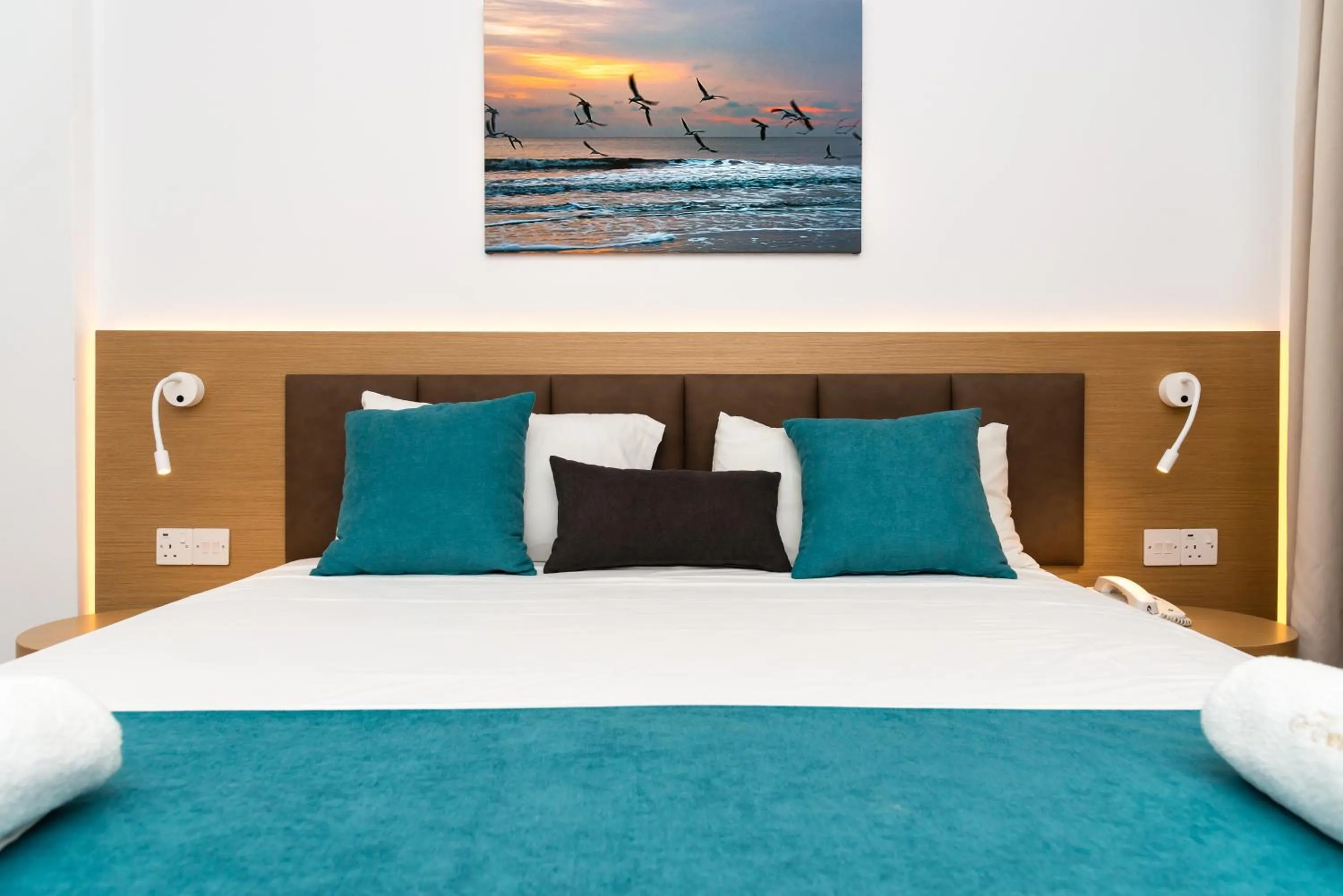 Bed in Helios Bay Hotel and Suites