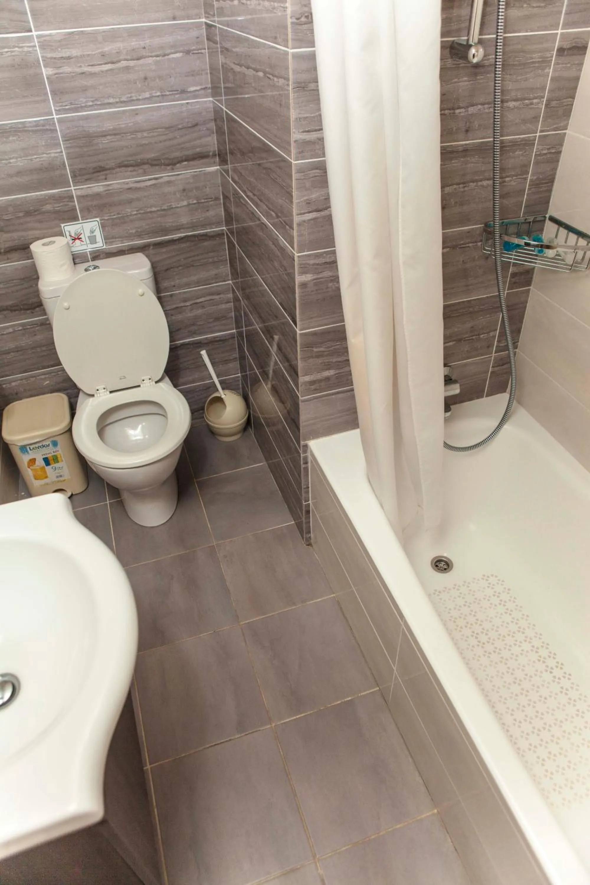 Toilet in Helios Bay Hotel and Suites