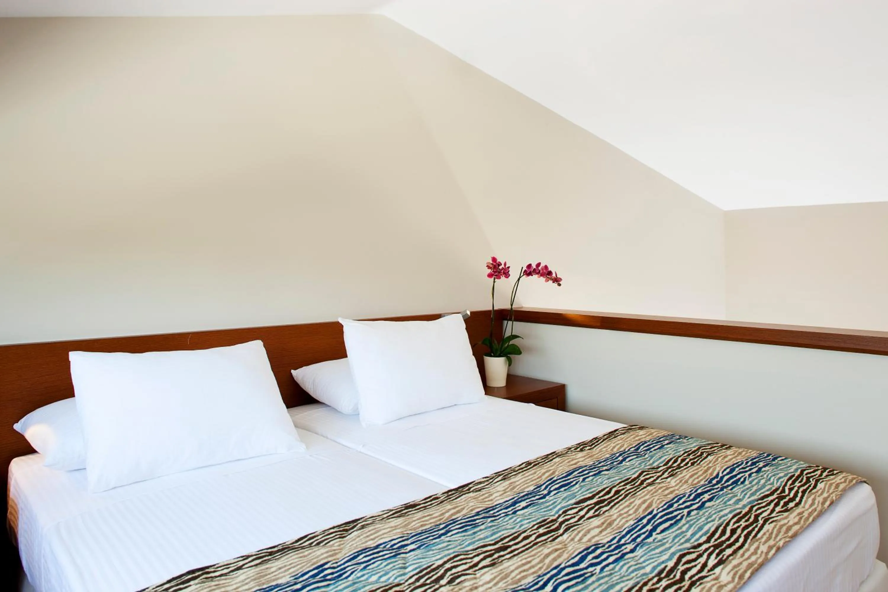 Bed in Apollonion Asterias Resort and Spa