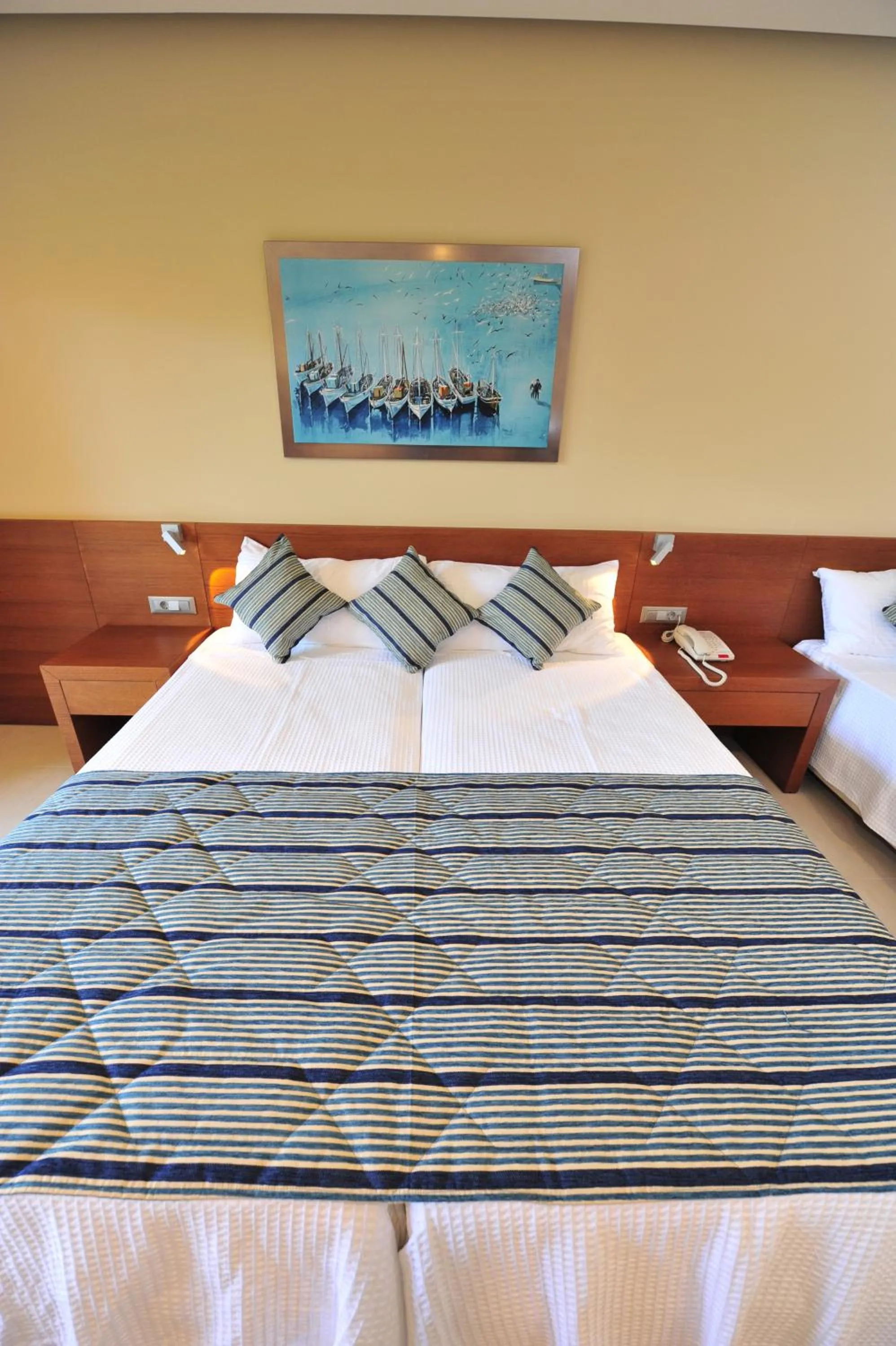 Bed in Apollonion Asterias Resort and Spa