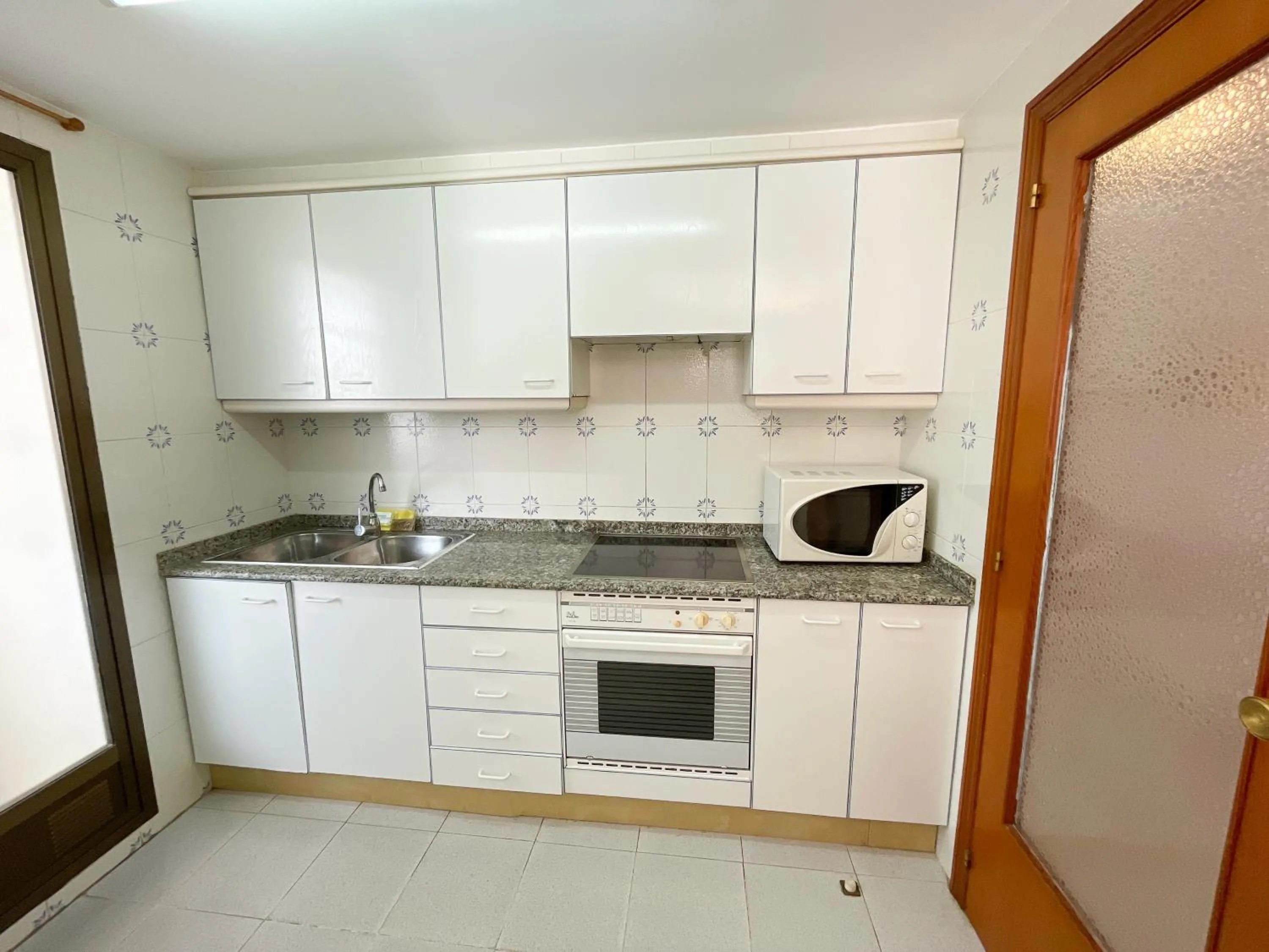 Kitchen or kitchenette in Apartamentos Olimpo 3000