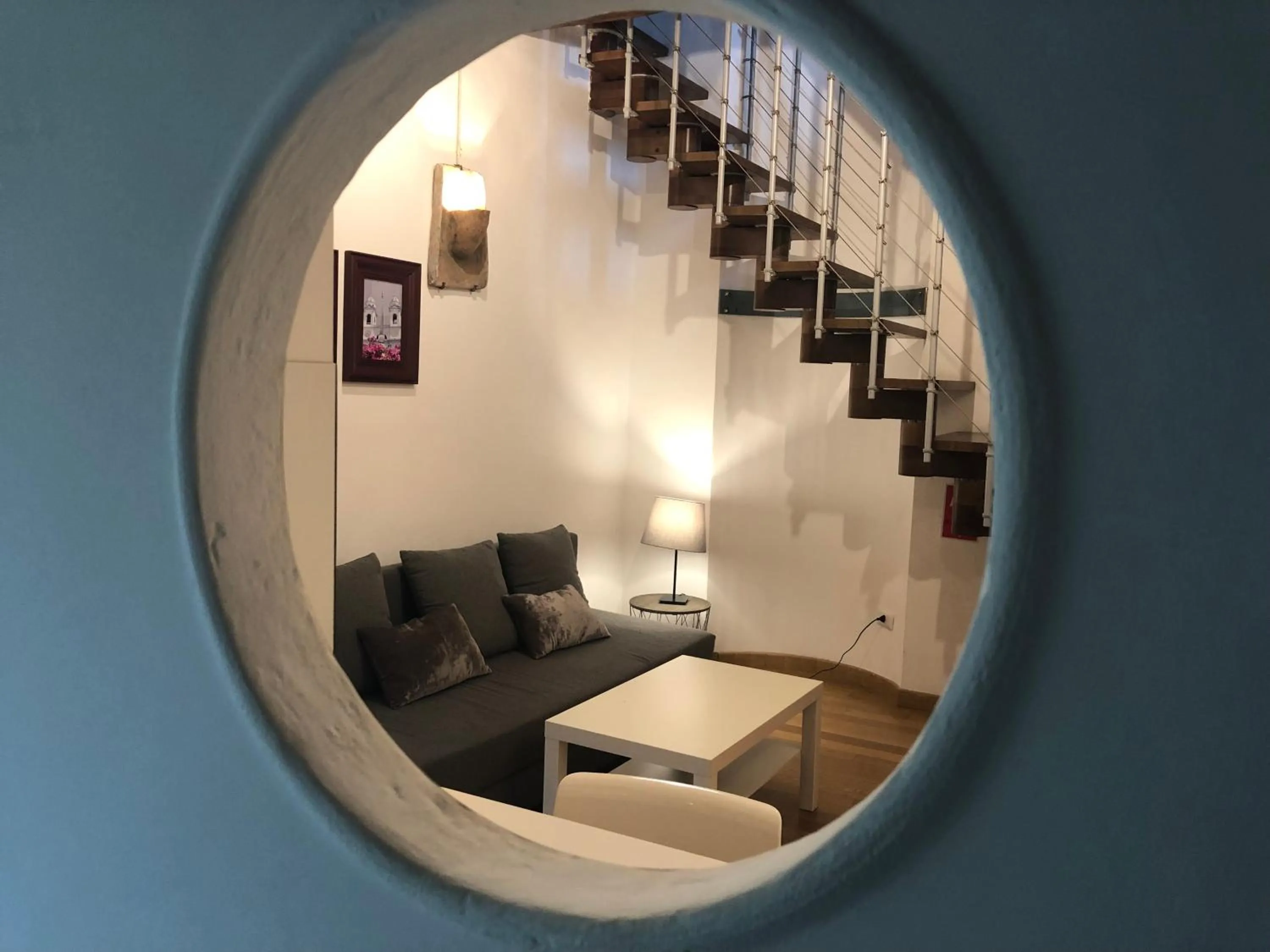 Communal lounge/ TV room in Giuturna Boutique Hotel