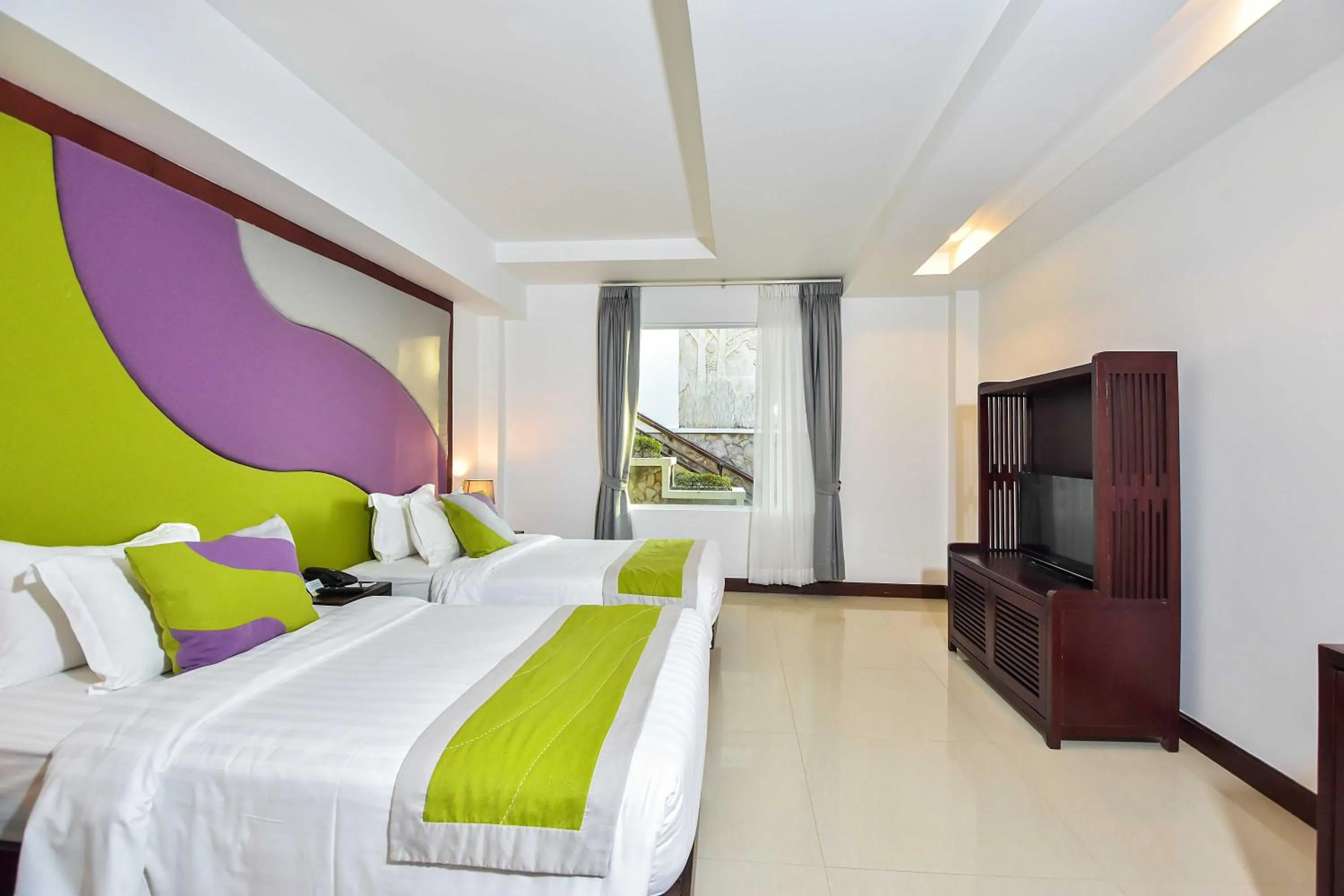 Bed in Independence Hotel Resort & Spa