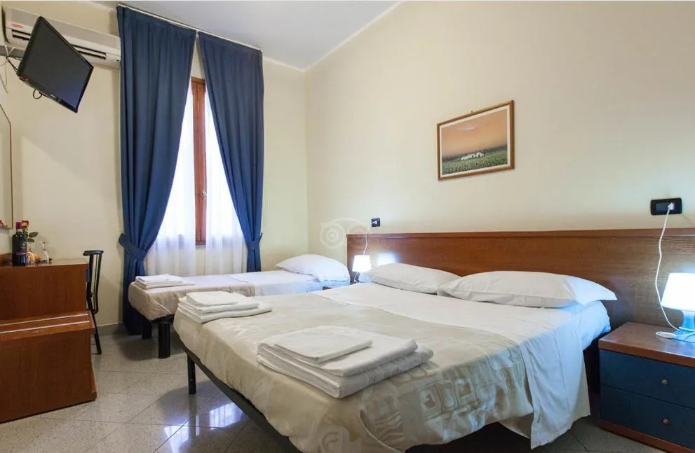 Bed in Hotel Greco