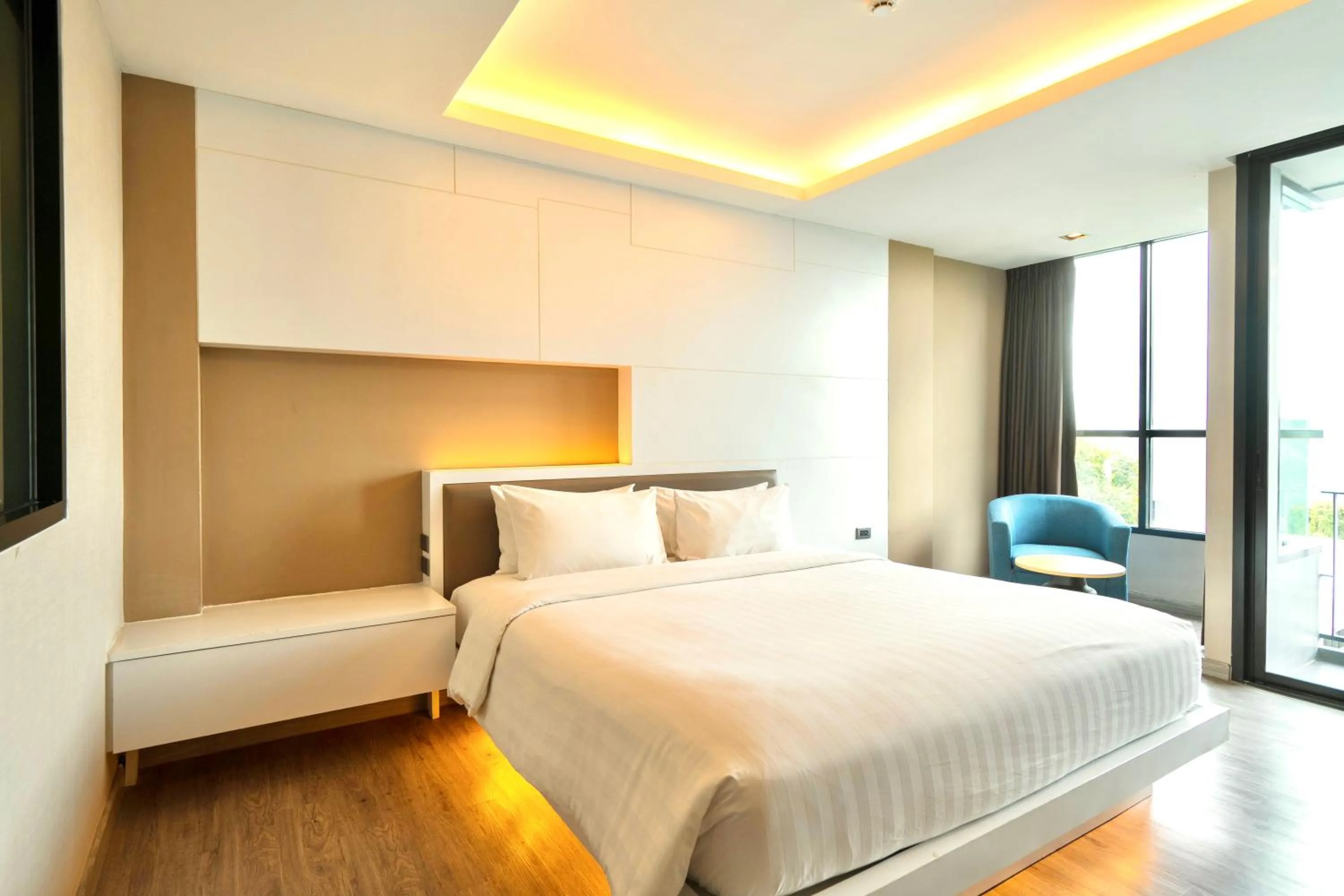 Bed in The Zense Boutique Hotel