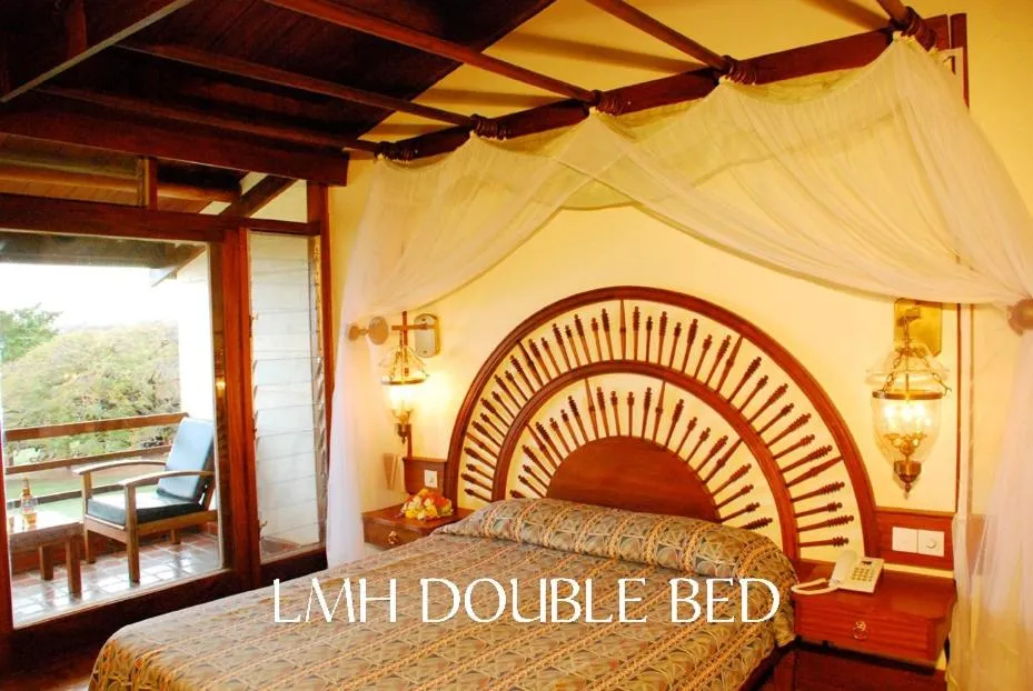 Bed in Lake Manyara Wildlife Lodge
