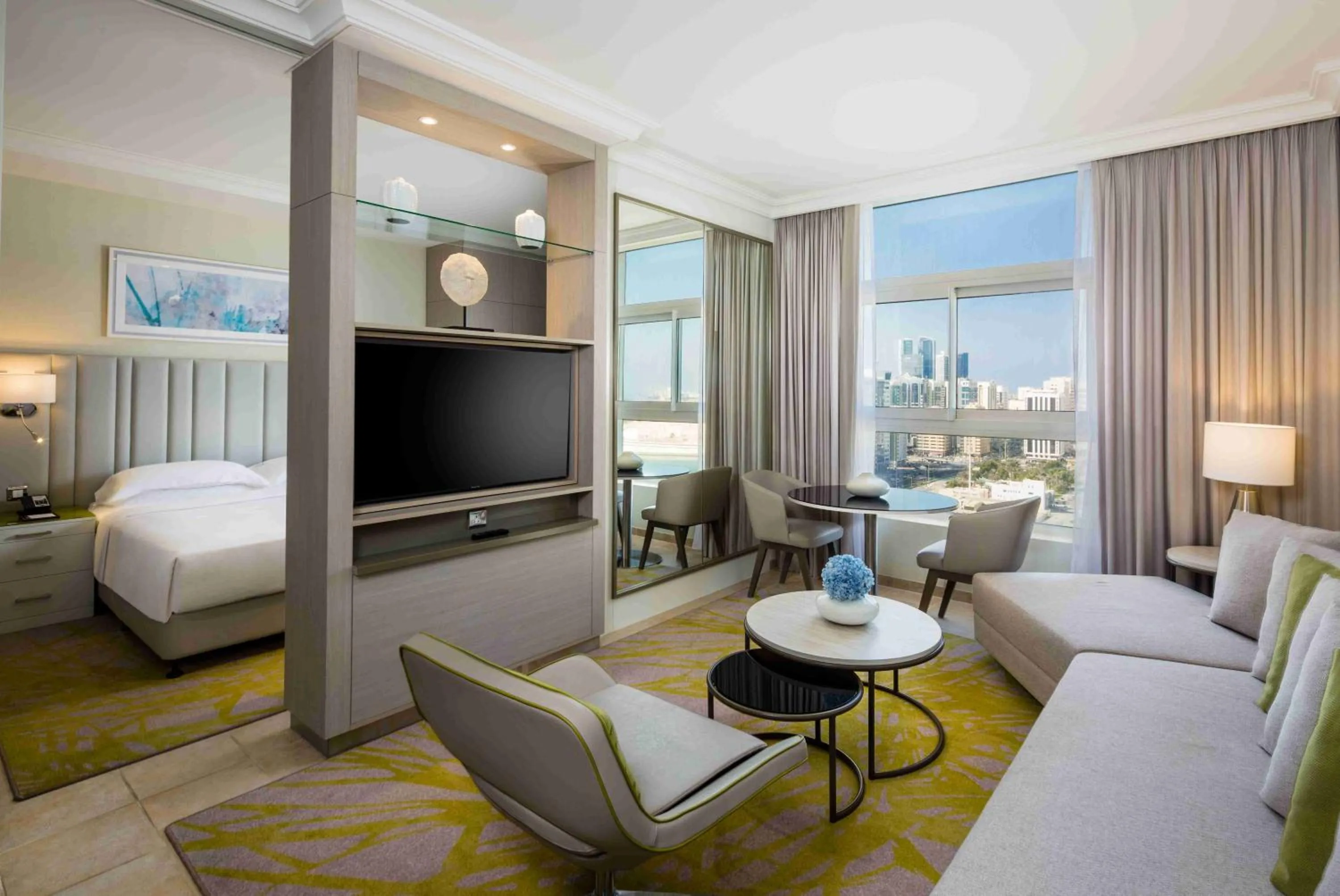 Living room, Bed in Beach Rotana – All Suites