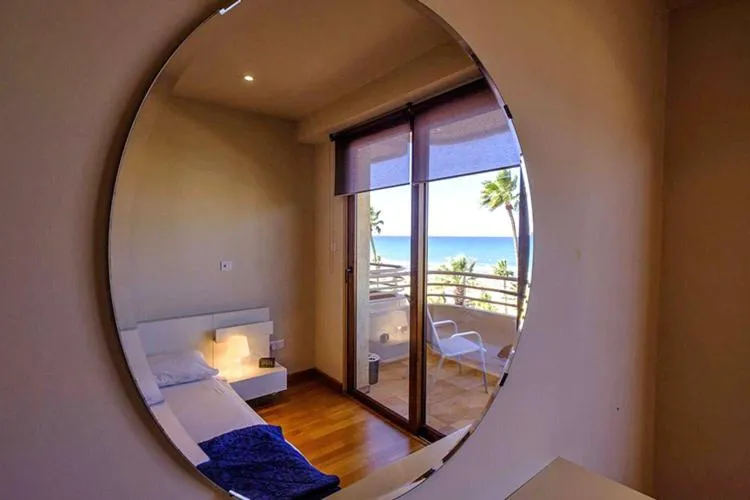 Bed in Les Palmiers Beach Boutique Hotel & Luxury Apartments