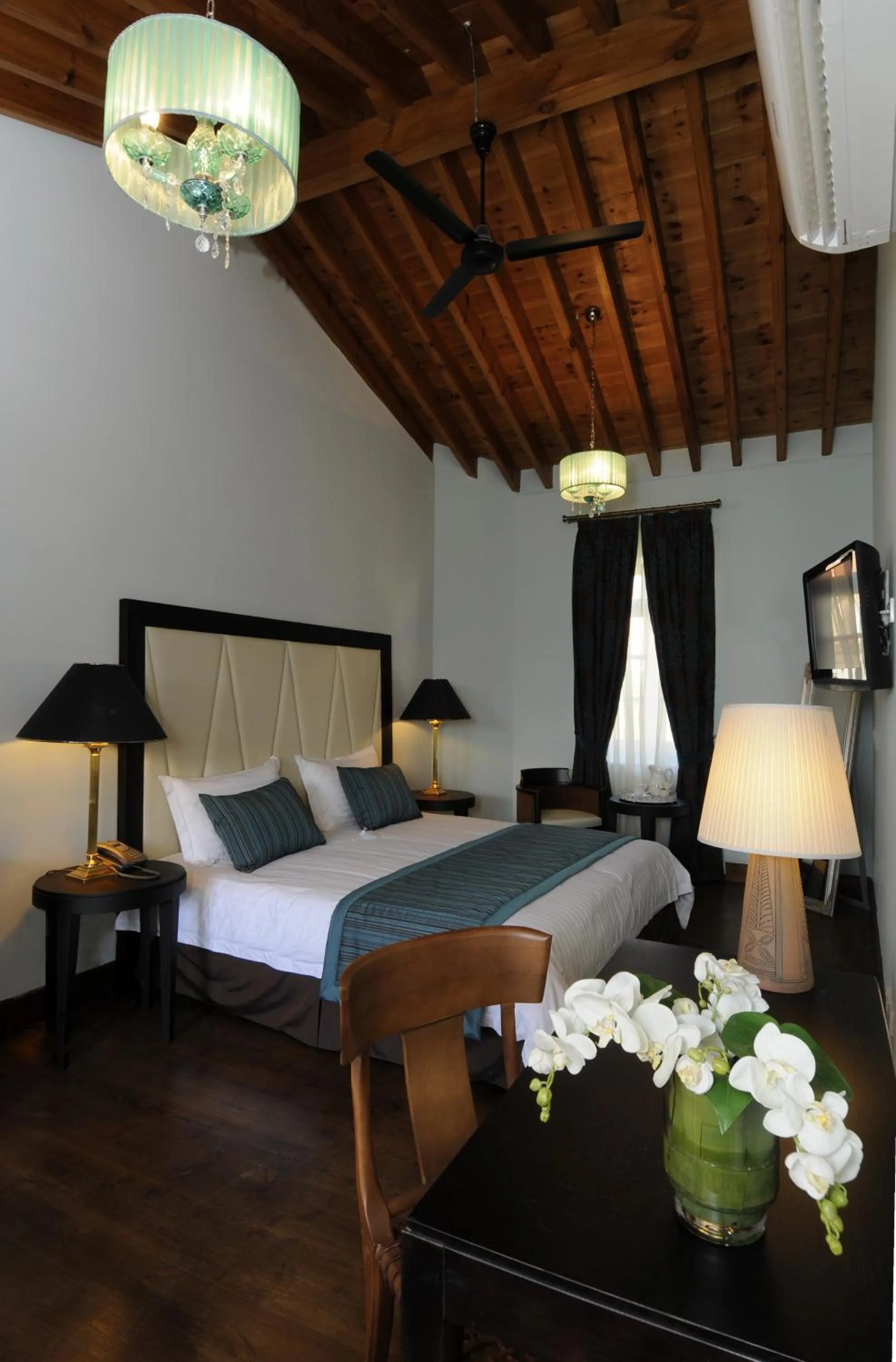 Bed in The Library Hotel Wellness Retreat