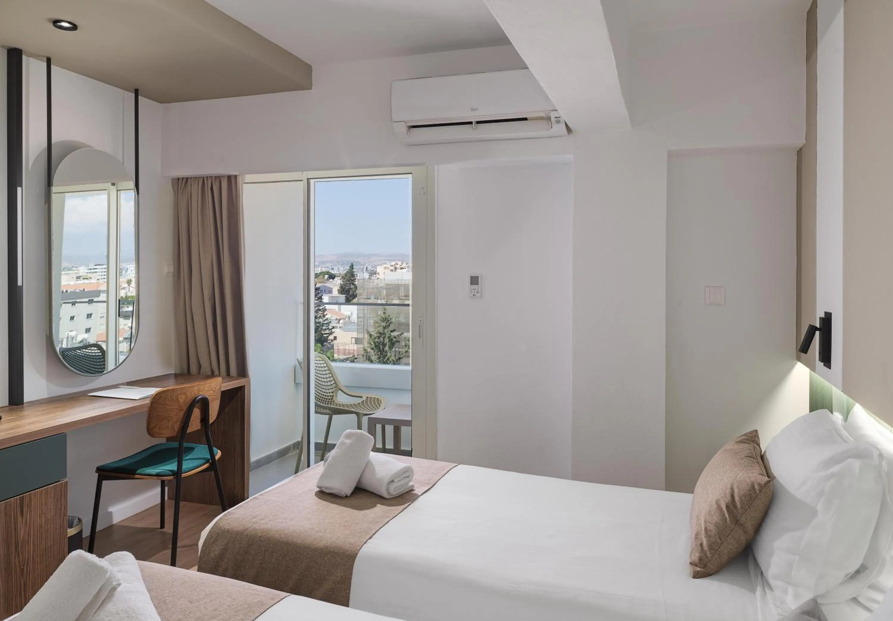 Bed in Pefkos City Hotel