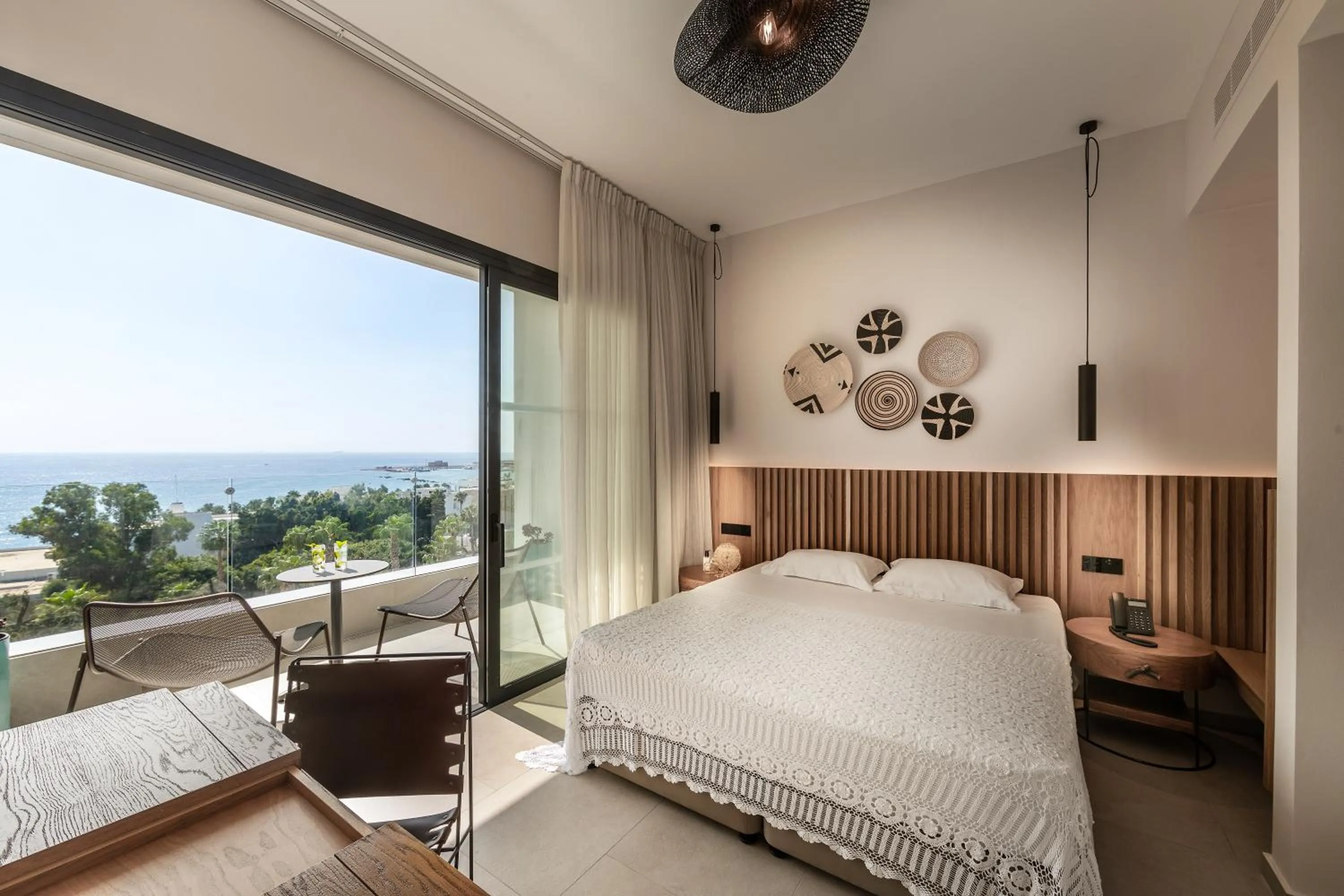 Bed in Anemi Hotel & Suites