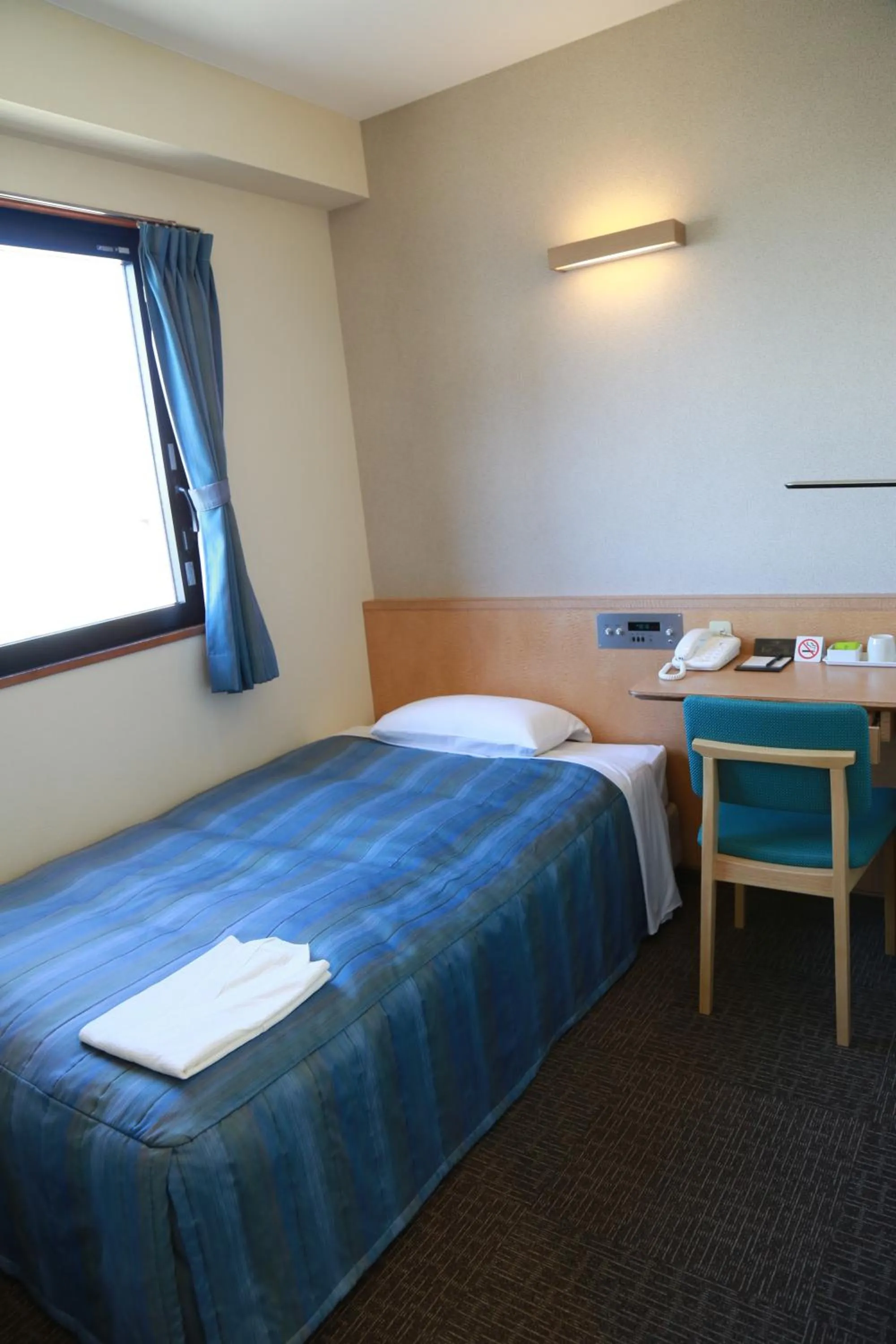 Bed in Hotel Plaza Arakawaoki