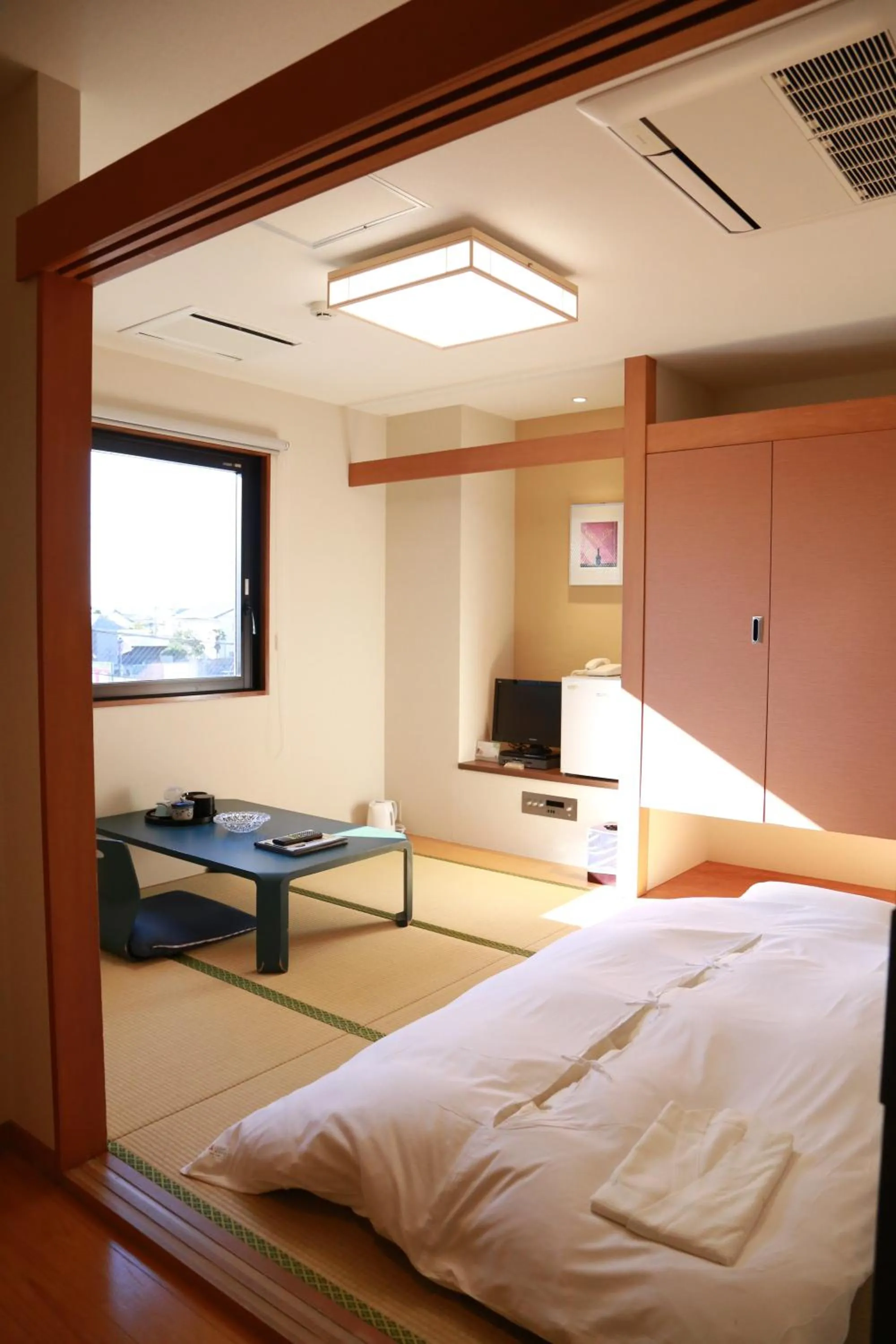 Bed in Hotel Plaza Arakawaoki