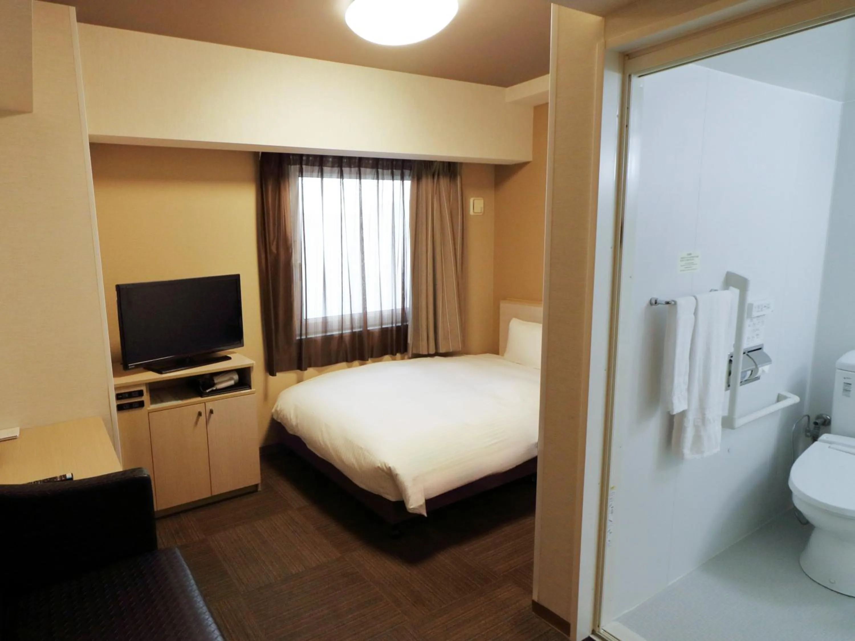 Photo of the whole room, Bed in Hotel Route-Inn Shimizu Inter
