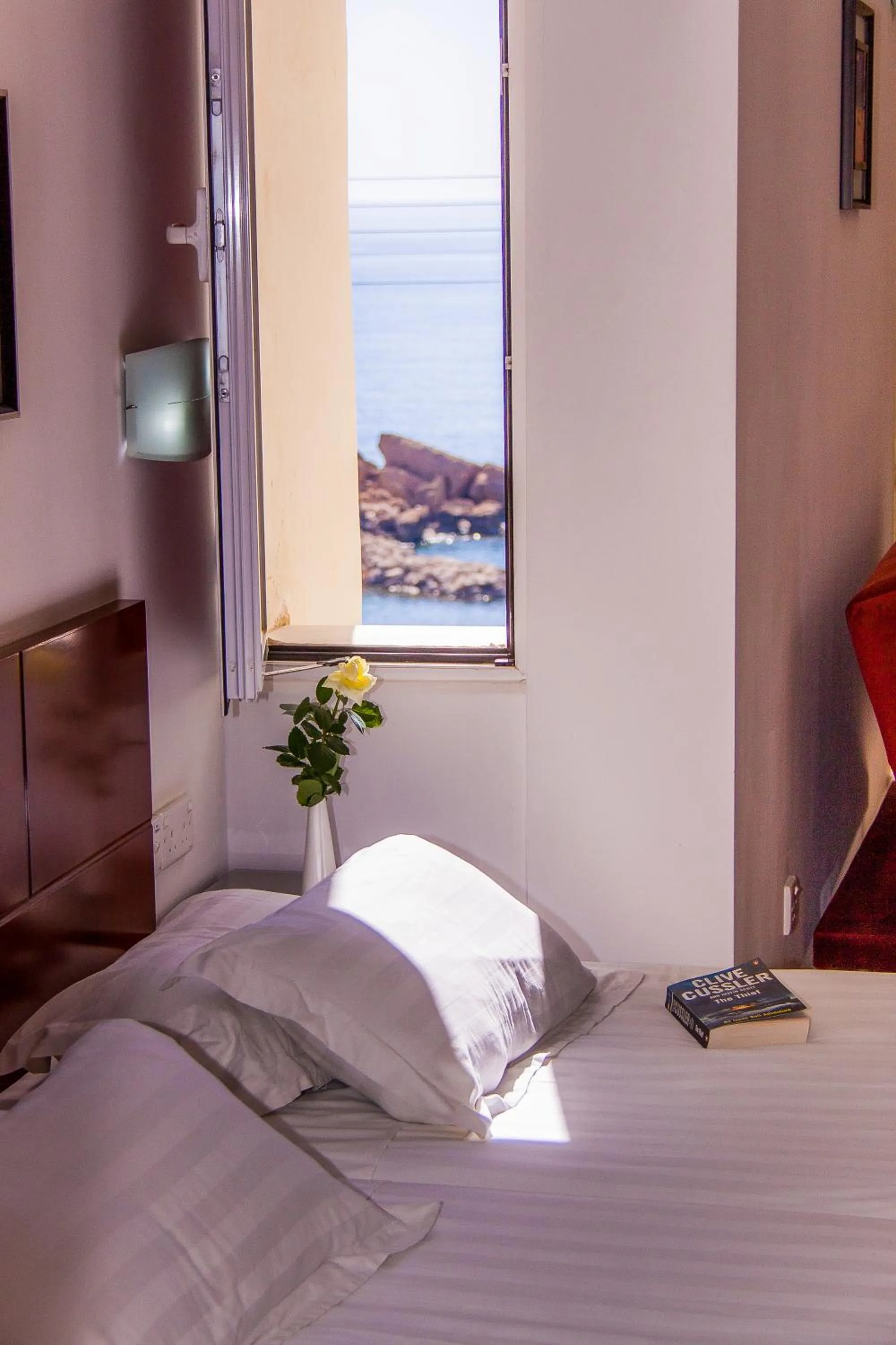 Bed in Theo Sunset Bay Hotel