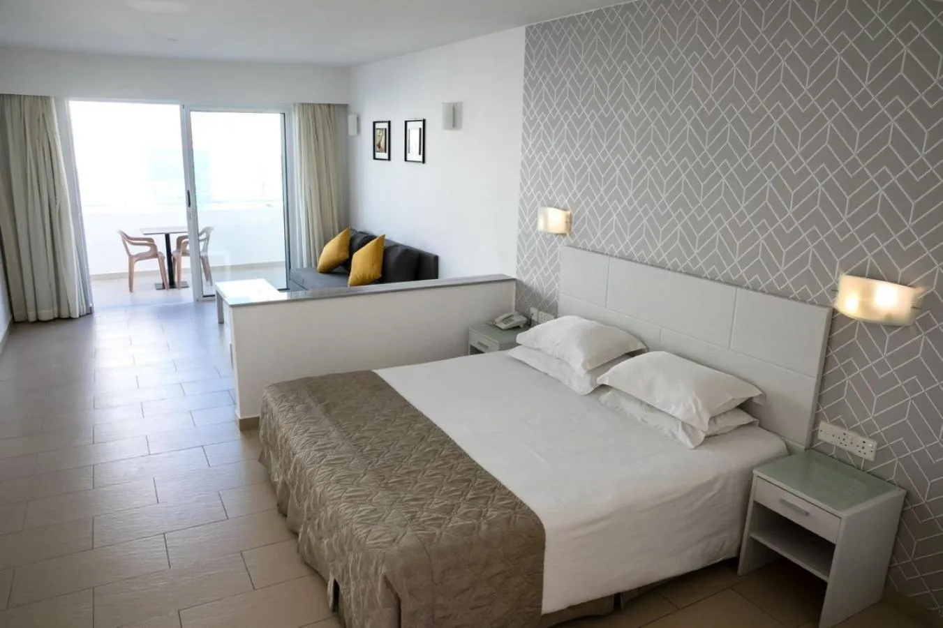 Bed in Theo Sunset Bay Hotel