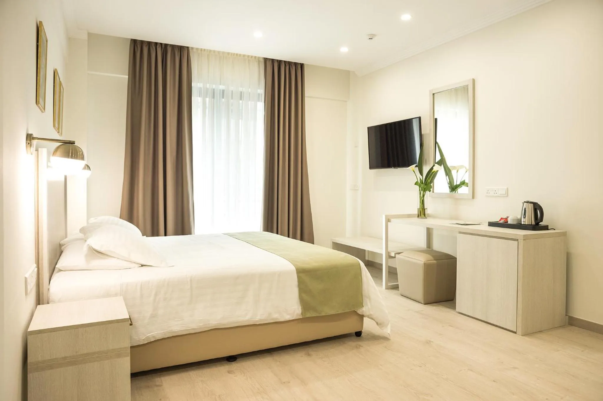 Bed in Roseum Boutique Hotel