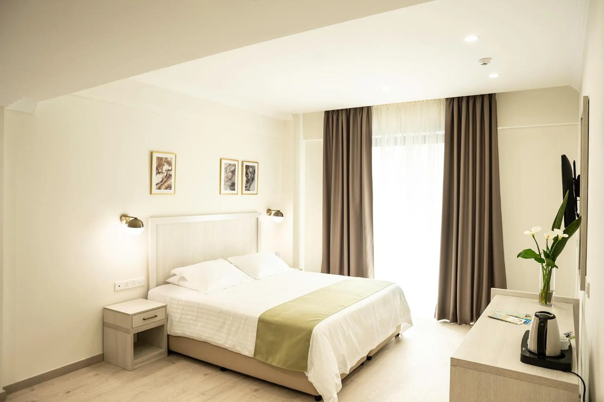 Bed in Roseum Boutique Hotel