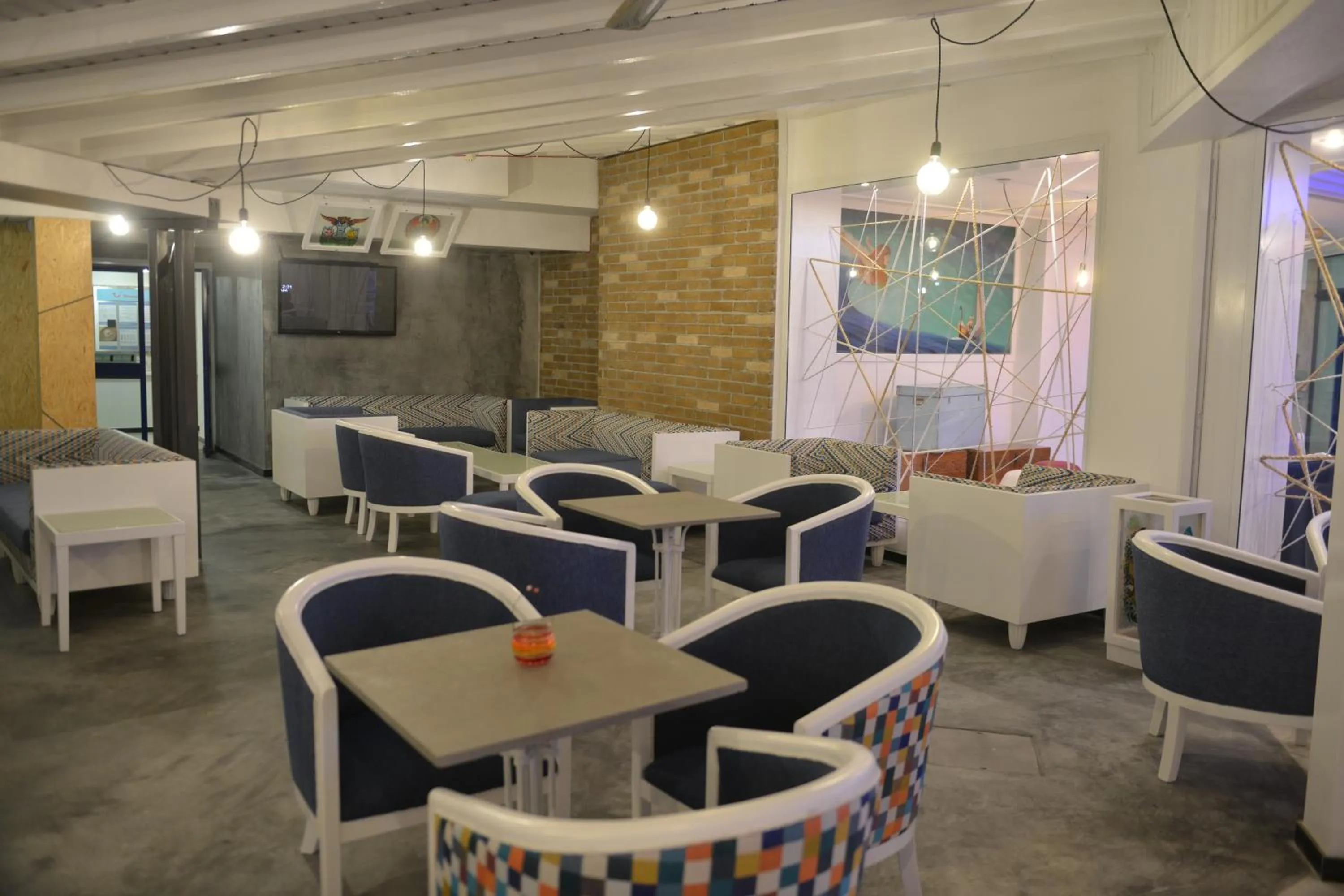 Communal lounge/ TV room in Nereus Hotel