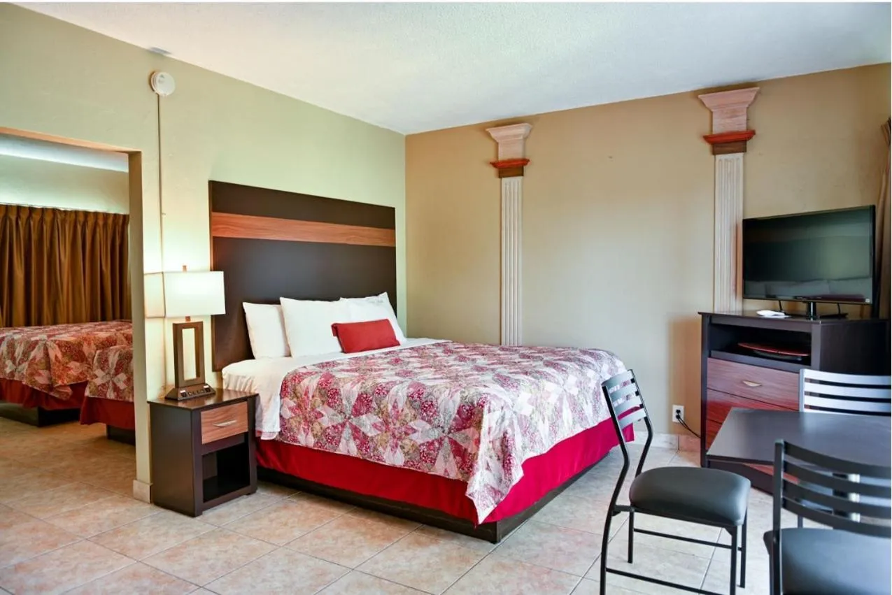 Photo of the whole room, Bed in Oceans Beach Resort & Suites