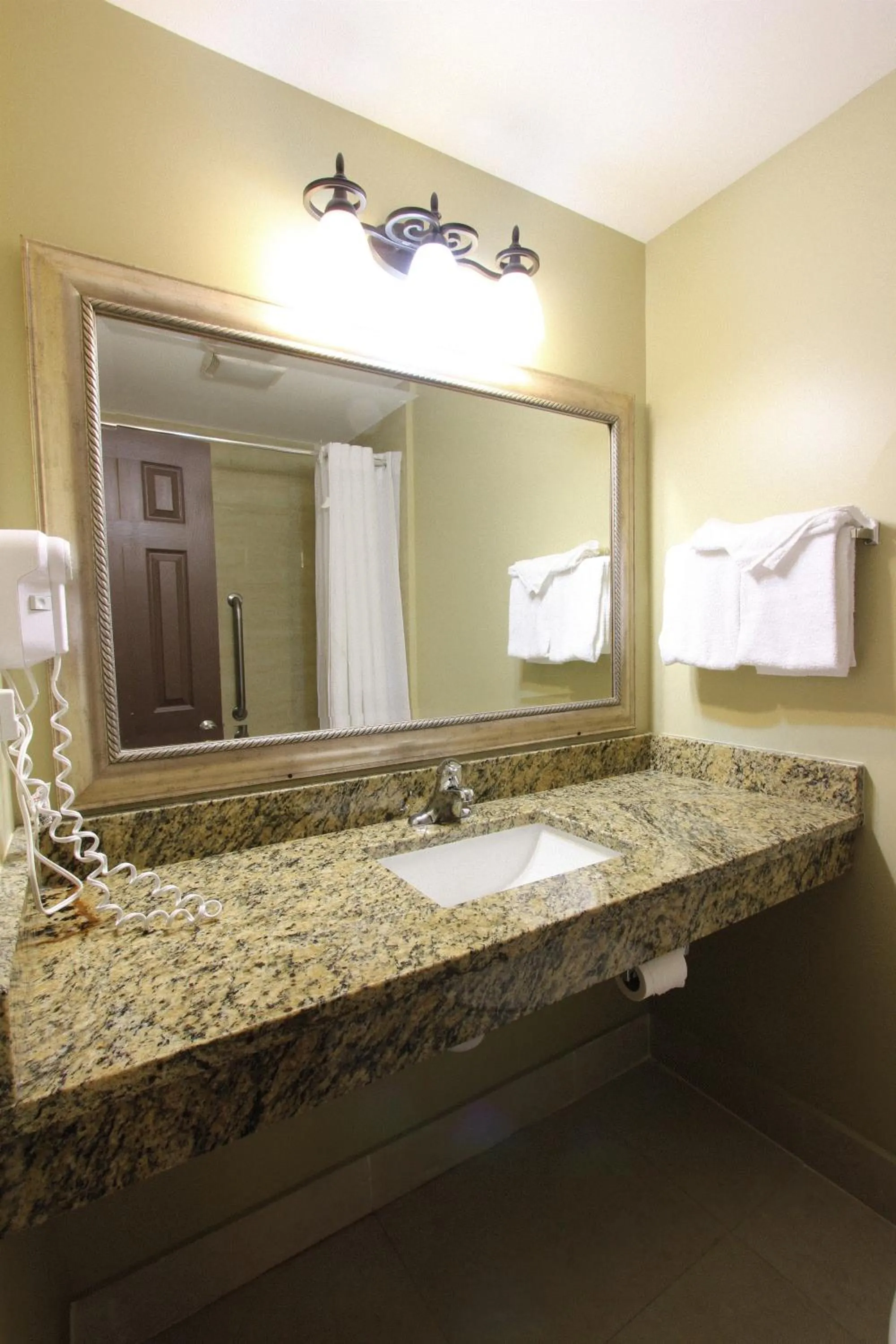 Bathroom in Oceans Beach Resort & Suites