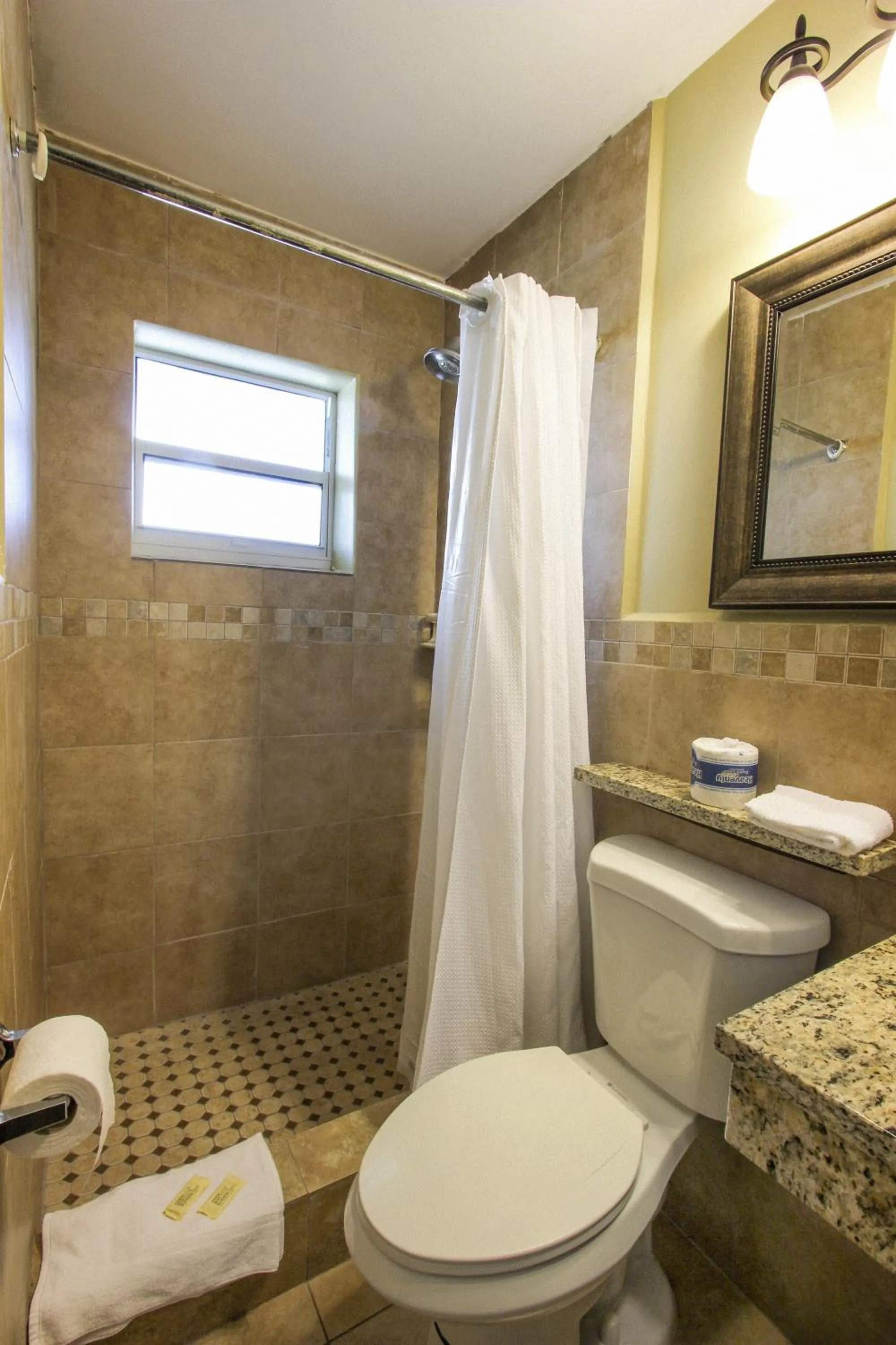 Bathroom in Oceans Beach Resort & Suites