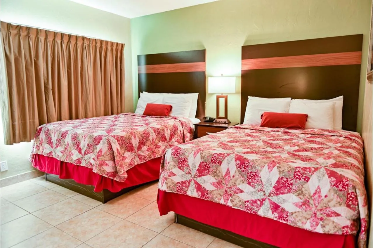Bedroom, Bed in Oceans Beach Resort & Suites