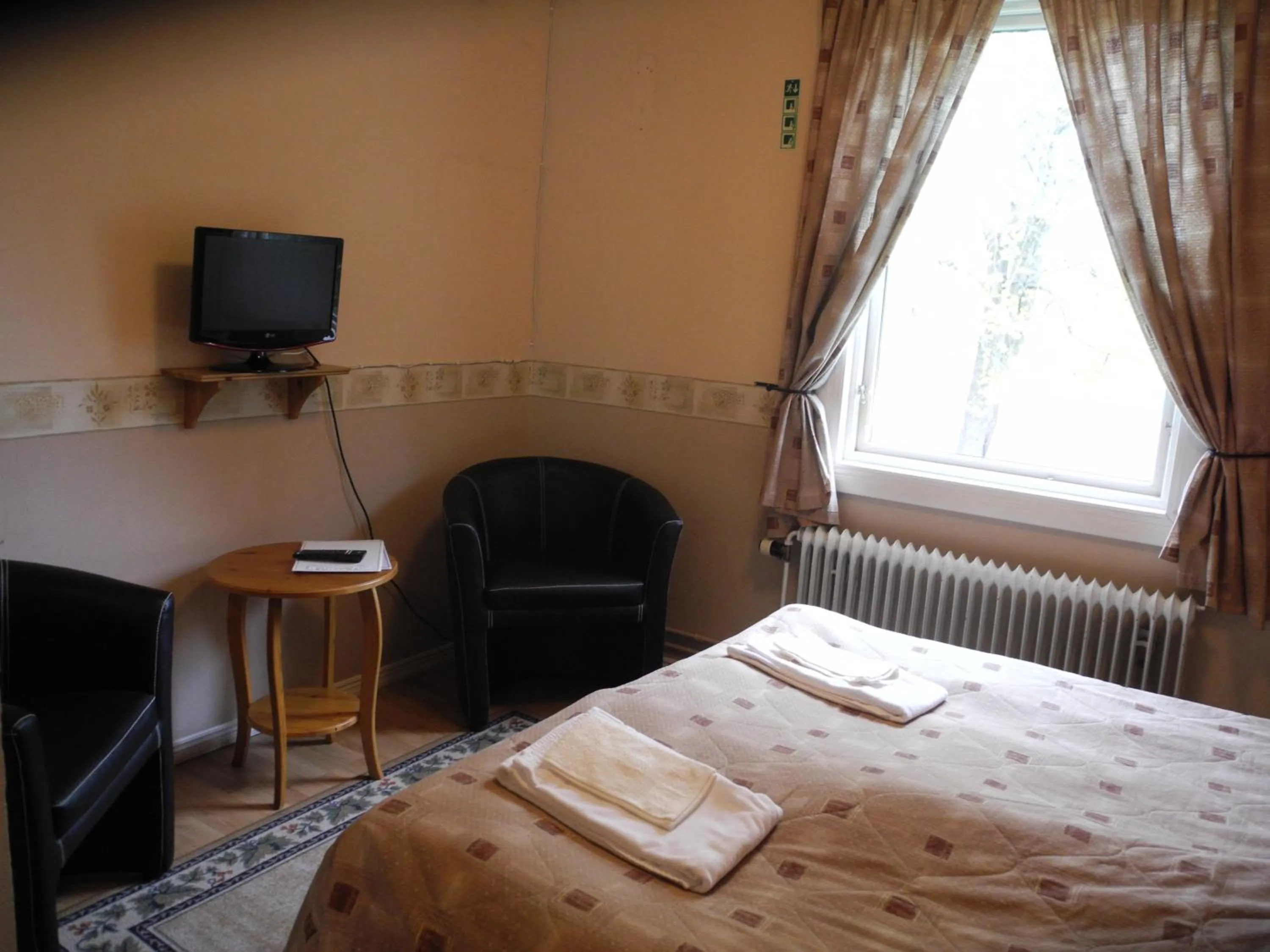 Photo of the whole room, Bed in Målilla Hotell & Restaurang