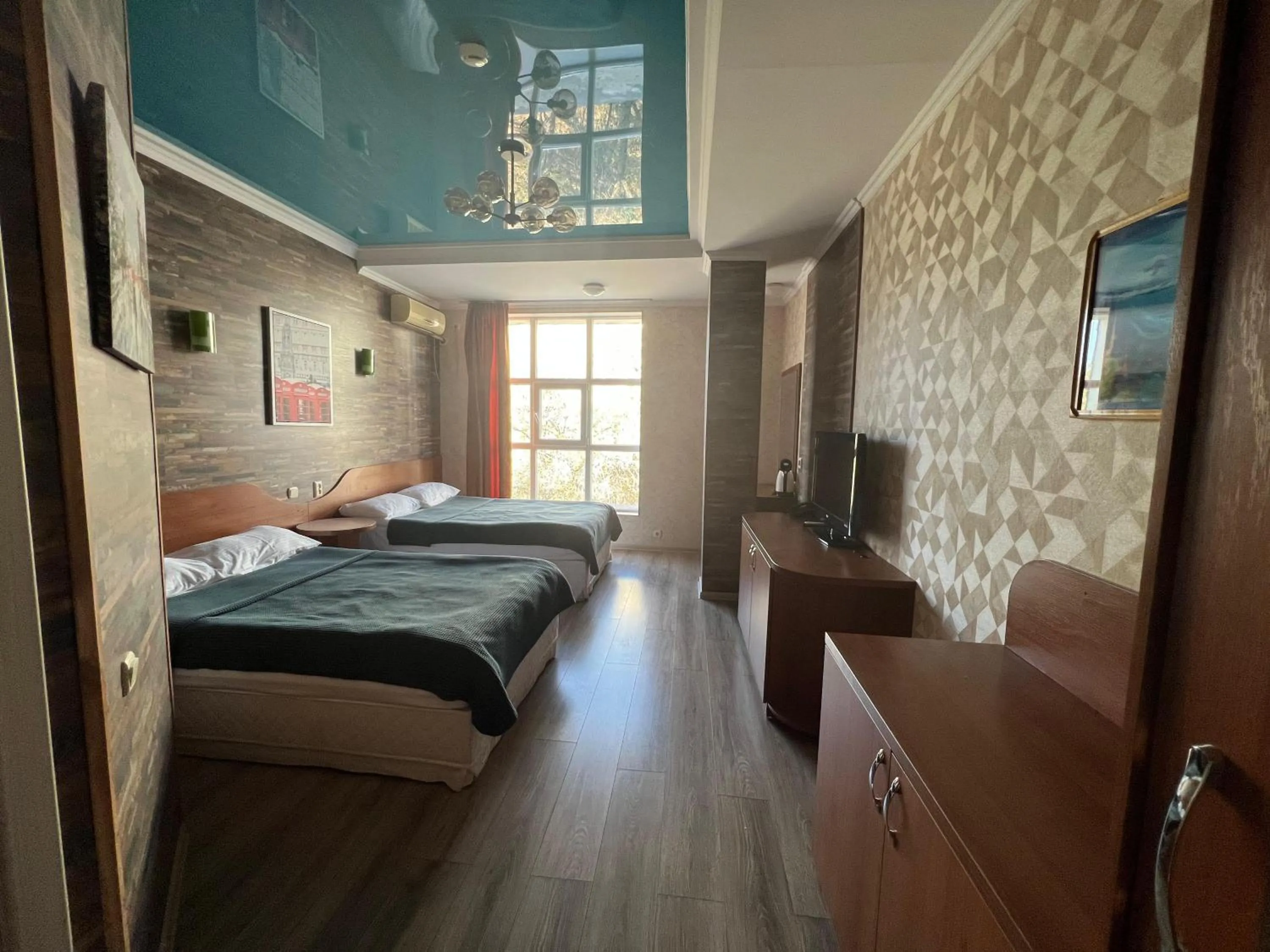 Bed in Three Dolphins Hotel