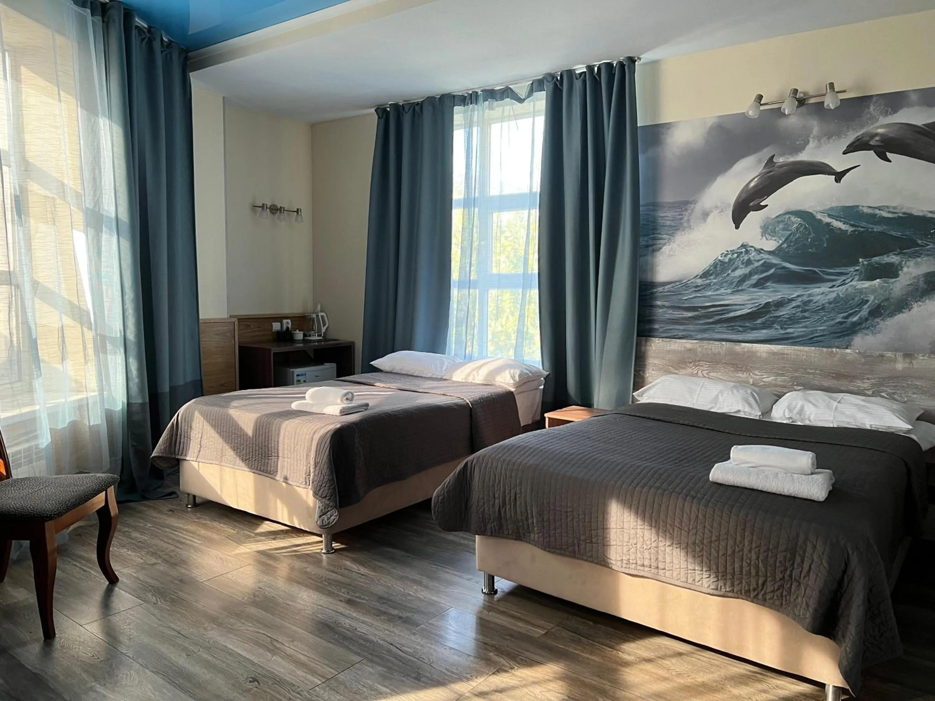 Bed in Three Dolphins Hotel