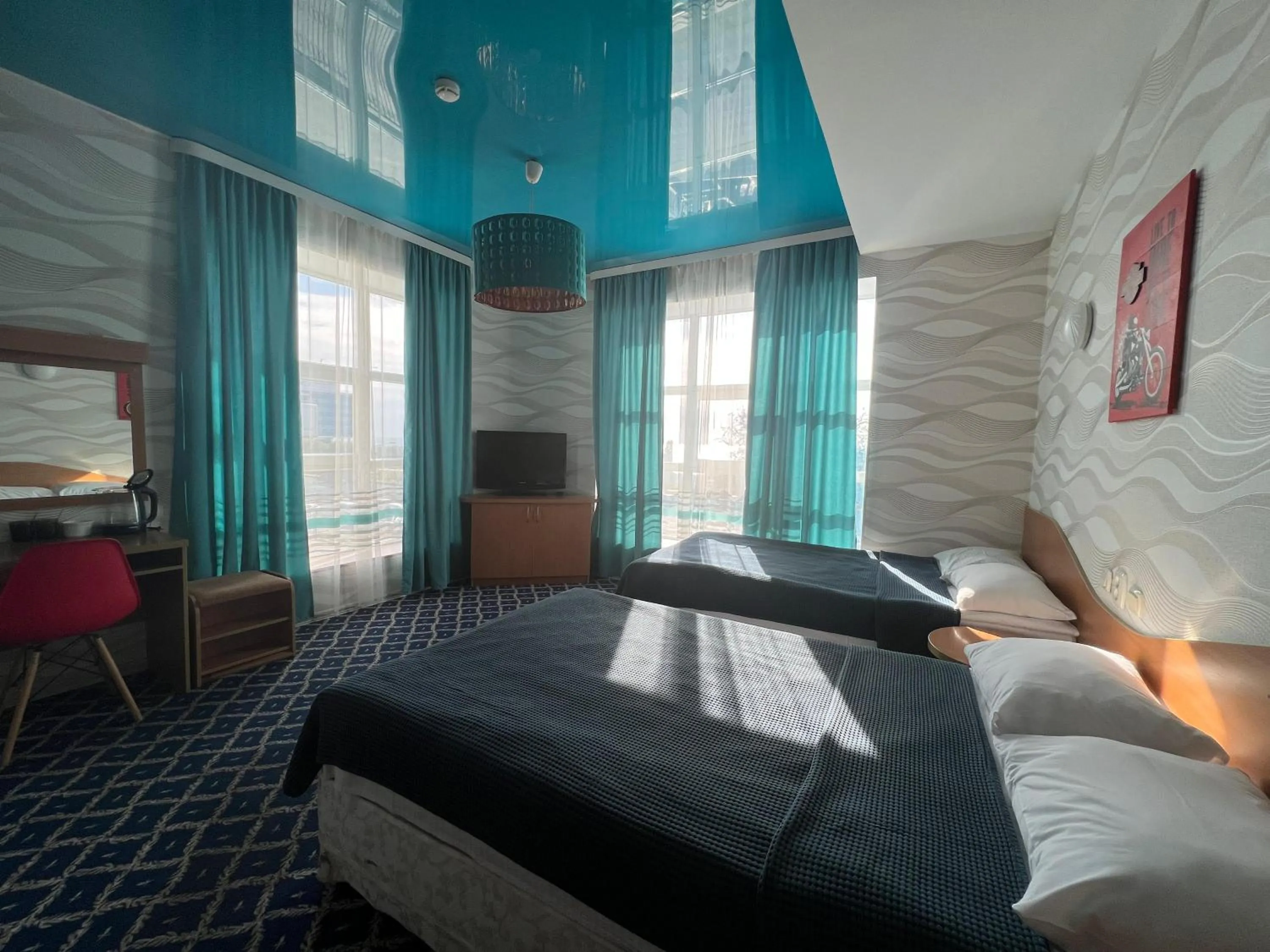 Bed in Three Dolphins Hotel