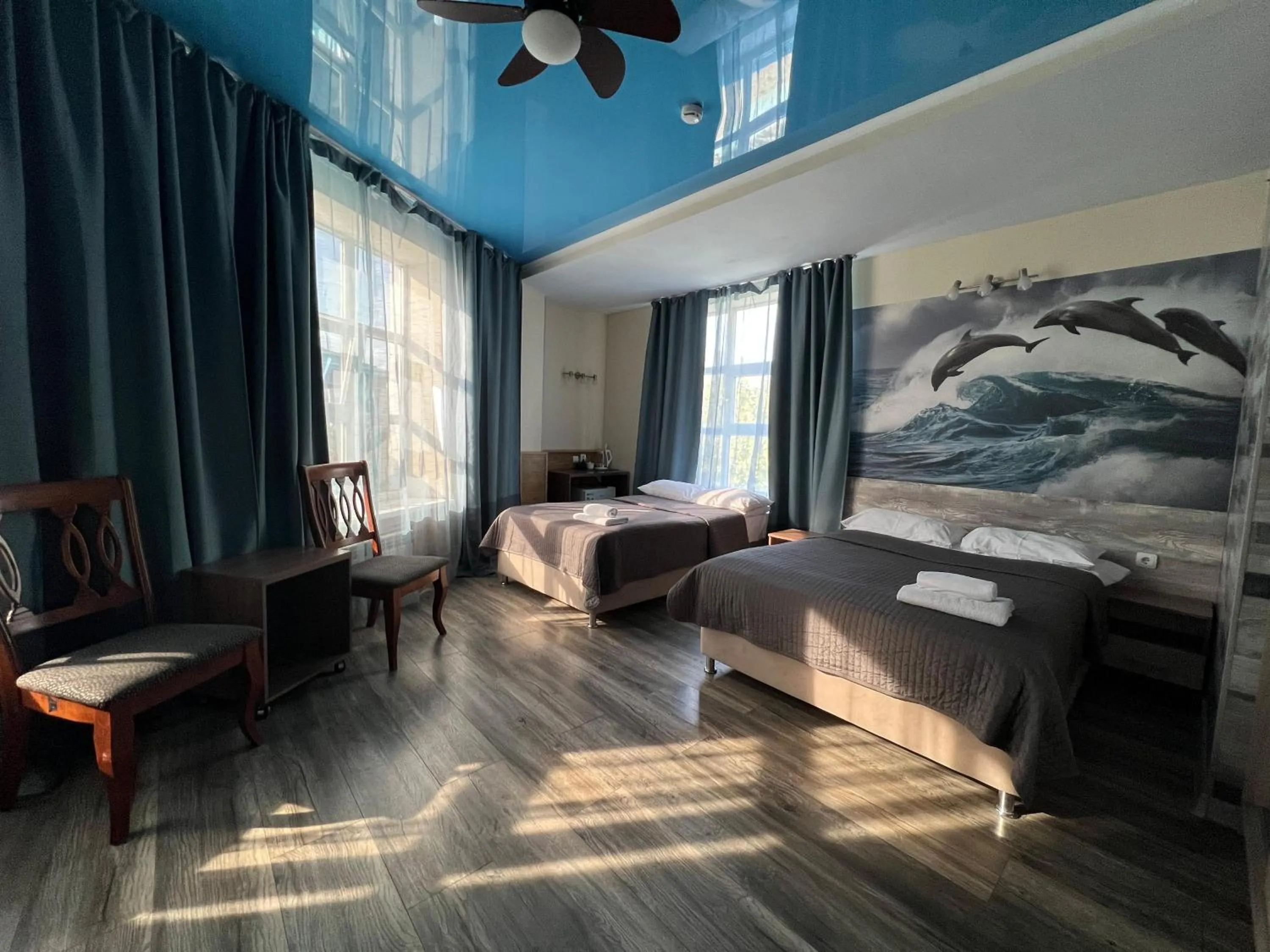 Bed in Three Dolphins Hotel