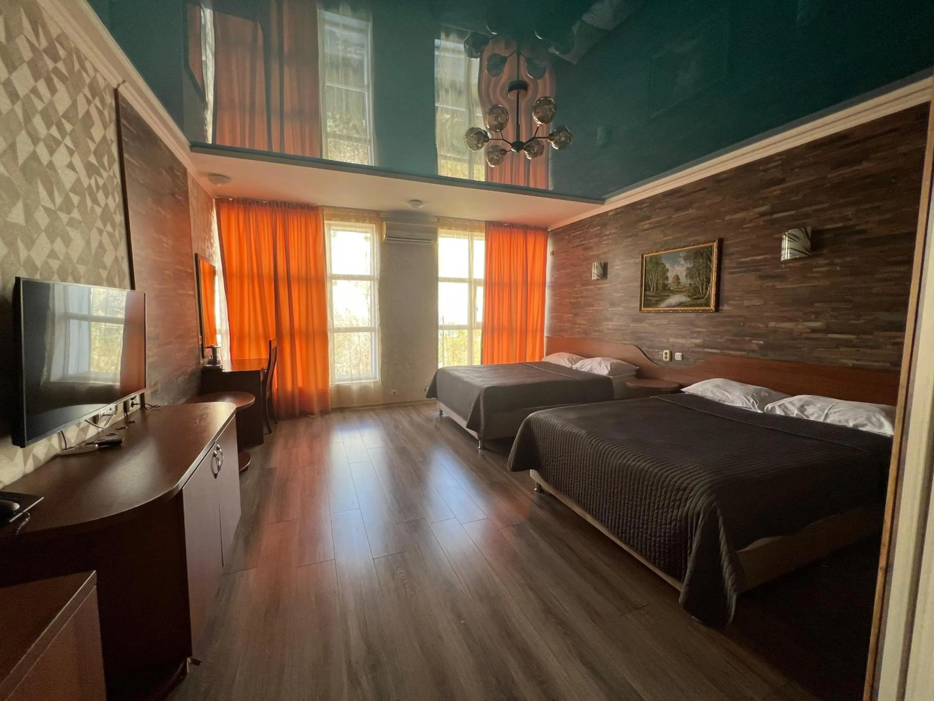 Bed in Three Dolphins Hotel
