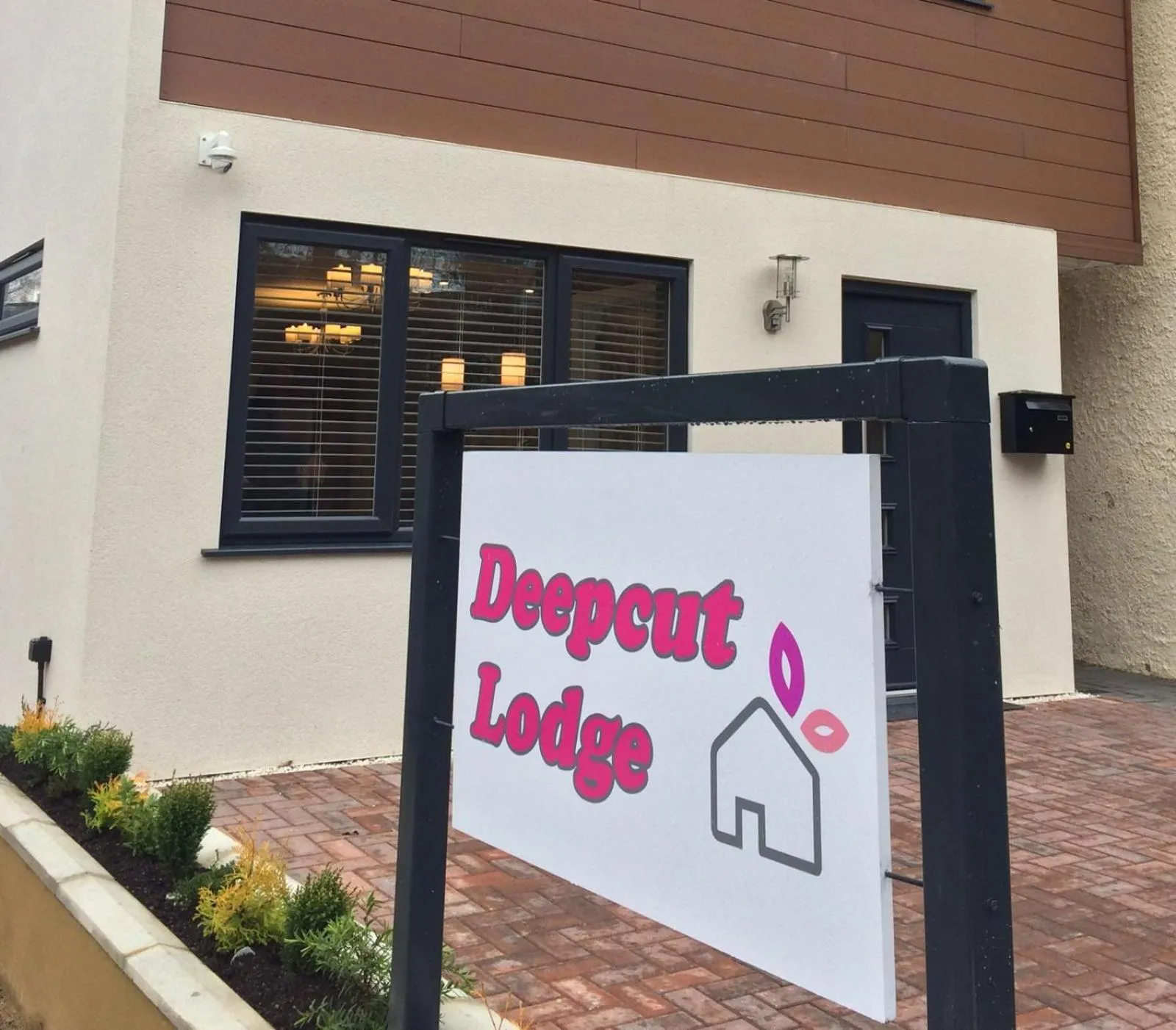 Property logo or sign in Deepcut Lodge Bed & Breakfast Self Service