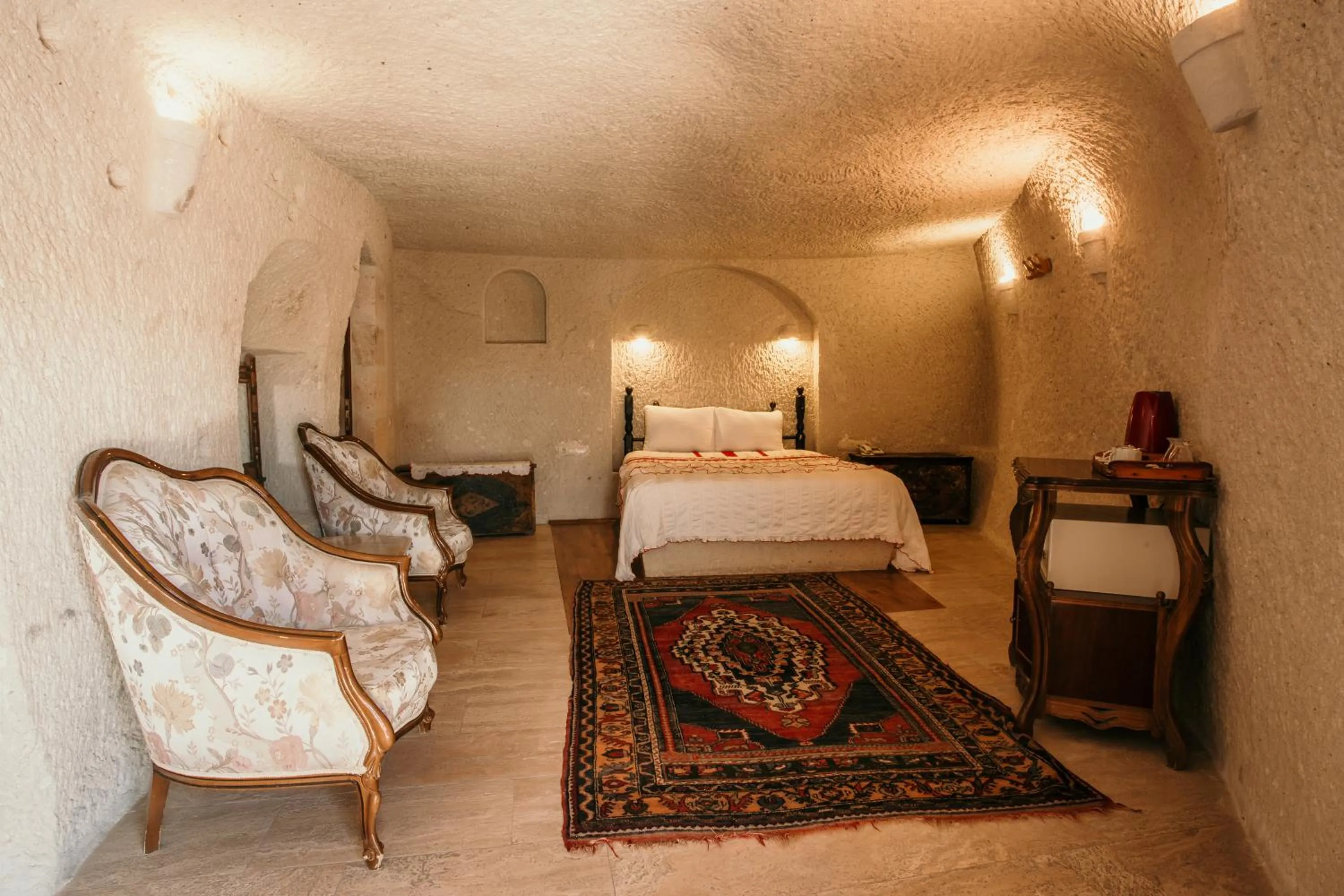 Bed in Village Cave House Hotel