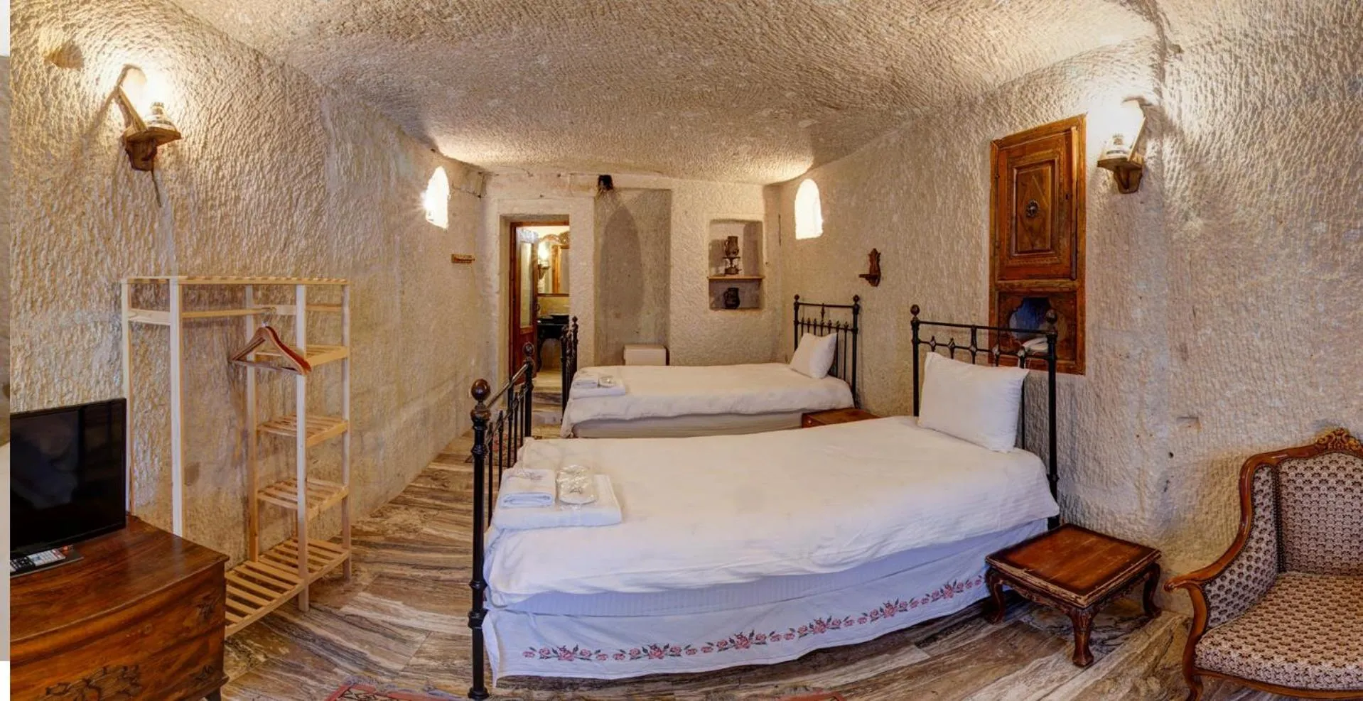 Bed in Village Cave House Hotel